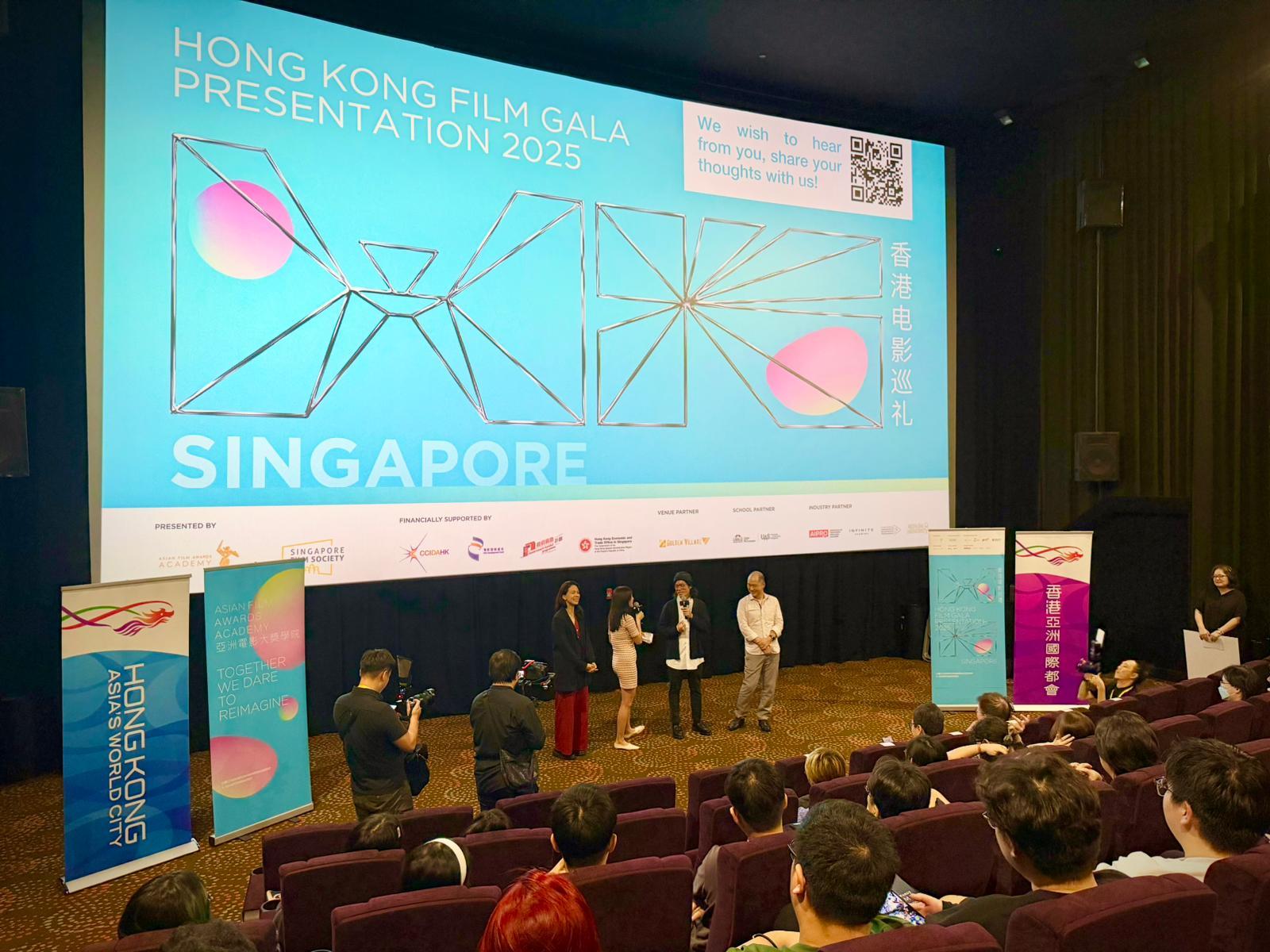 The Hong Kong Economic and Trade Office in Singapore (Singapore ETO) is continuing its support for the annual Hong Kong Film Gala Presentation (the Gala Presentation) in Singapore, which this year is featuring six recent Hong Kong productions across a diverse range of genres, from animation and drama to documentary and family entertainment. The event is organised by the Asian Film Awards Academy and is co-organised with the Singapore Film Society, with financial support from the Film Development Fund, the Cultural and Creative Industries Development Agency, and the Singapore ETO. The Gala Presentation opened this evening (December 18). Photo shows Director Tommy Ng (second right) and Producer Chan Gin-kai (first right) of the opening film "Another World"; and actor Rosa Maria Velasco (first left) of "Golden Boy", meeting with audiences before the opening screening.