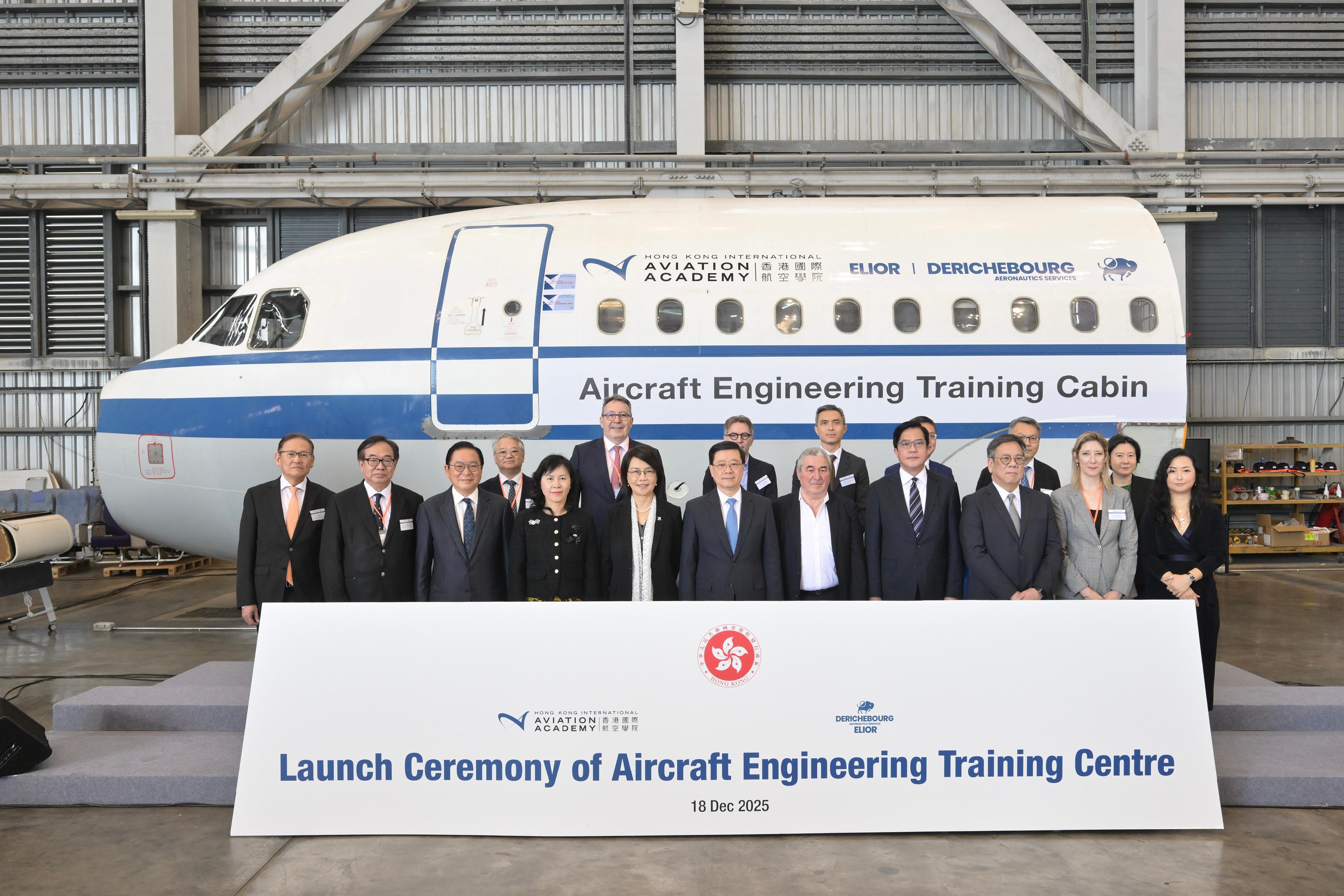 The Chief Executive, Mr John Lee, attended the Launch Ceremony of Aircraft Engineering Training Centre today (December 18). Photo shows (front row, from fourth left) the Secretary for Transport and Logistics, Ms Mable Chan; the Chief Executive Officer of the Airport Authority Hong Kong, Mrs Vivian Cheung; Mr Lee; the Group Chairman and Chief Executive Officer of Elior Group SA, Mr Daniel Derichebourg; the Deputy Financial Secretary, Mr Michael Wong; the Secretary for Commerce and Economic Development, Mr Algernon Yau, and other guests at the ceremony.
