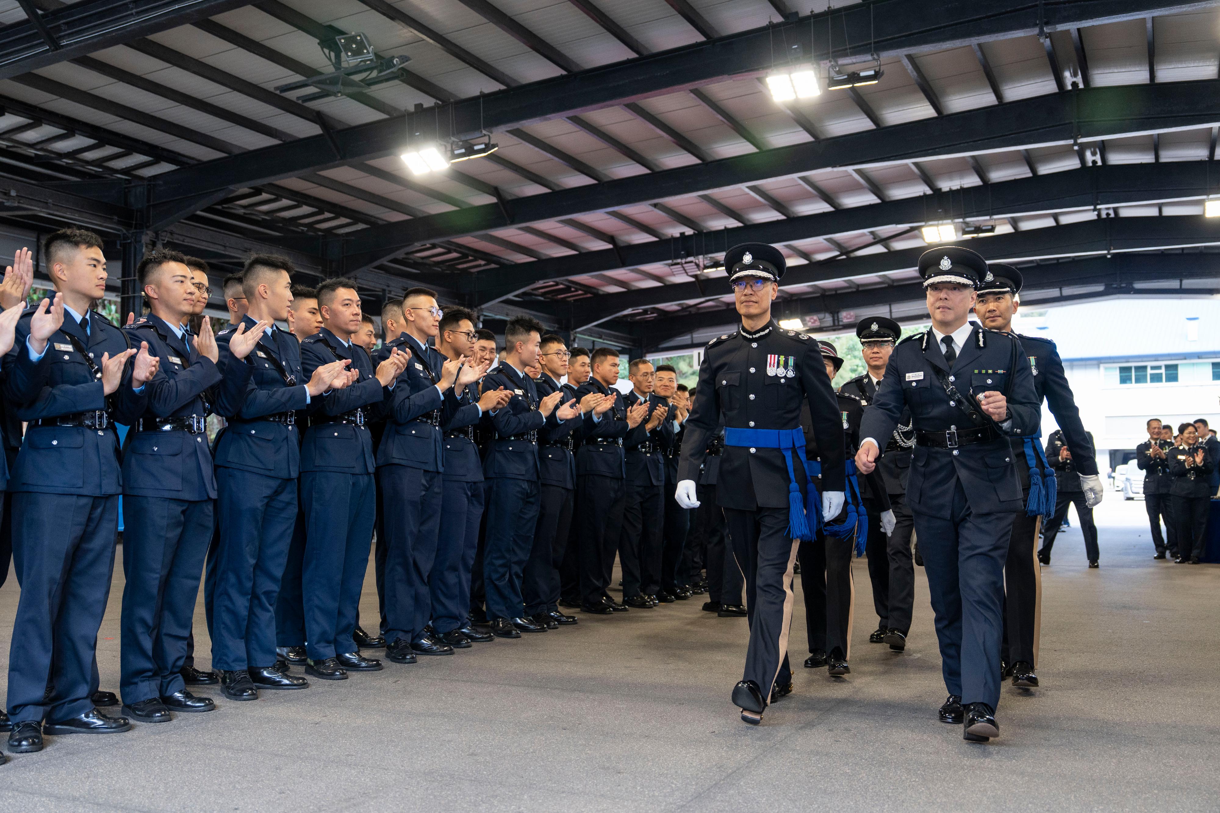 The Commissioner of Police, Mr Chow Yat-ming (front row, first right), and the Deputy Commissioner of Police (Operations), Mr Yip Wan-lung (front row, second right), attend a passing-out parade held at the Hong Kong Police College today (December 20).