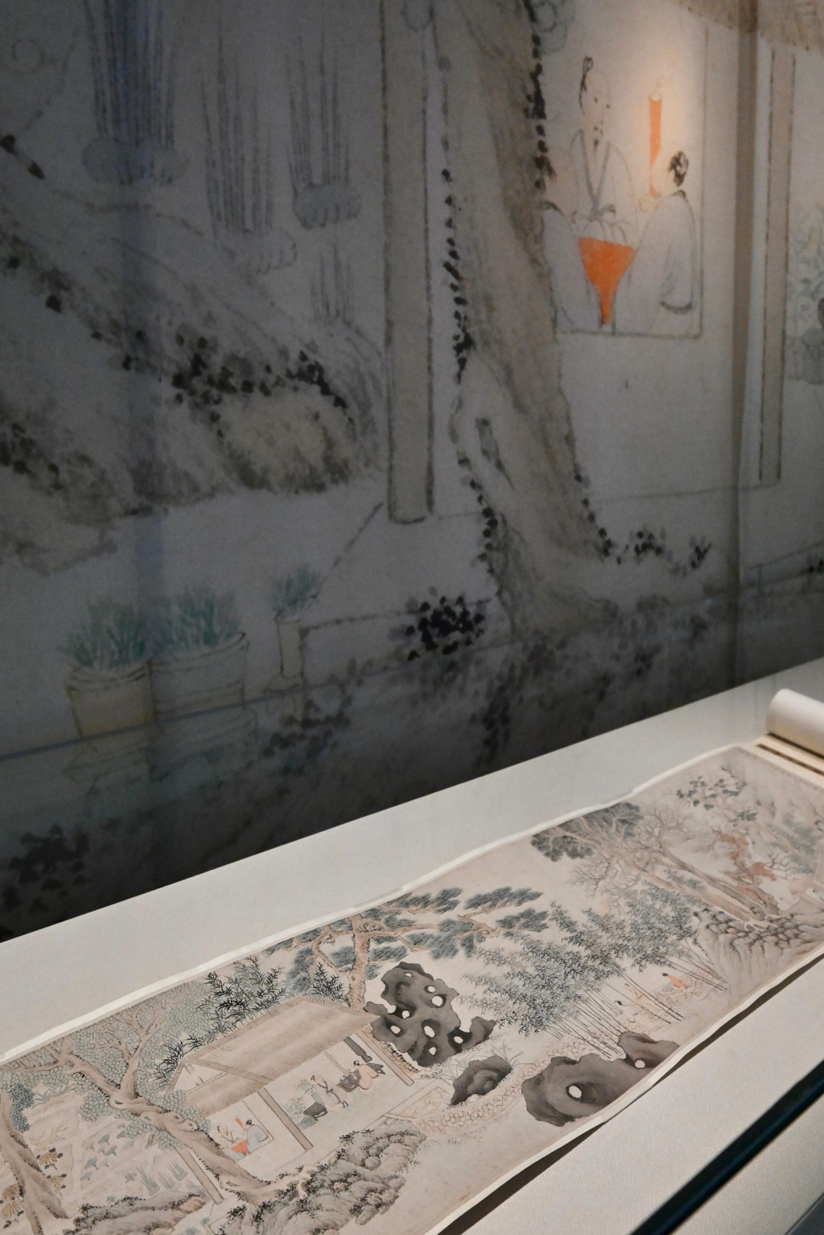 香港艺术馆今日（十二月二十三日）起推出「画中小人物」展览，邀请观众以不同角度欣赏至乐楼的中国书画藏品。图示《药草山房图》手卷，画中描绘了雨后文人相聚的情景。