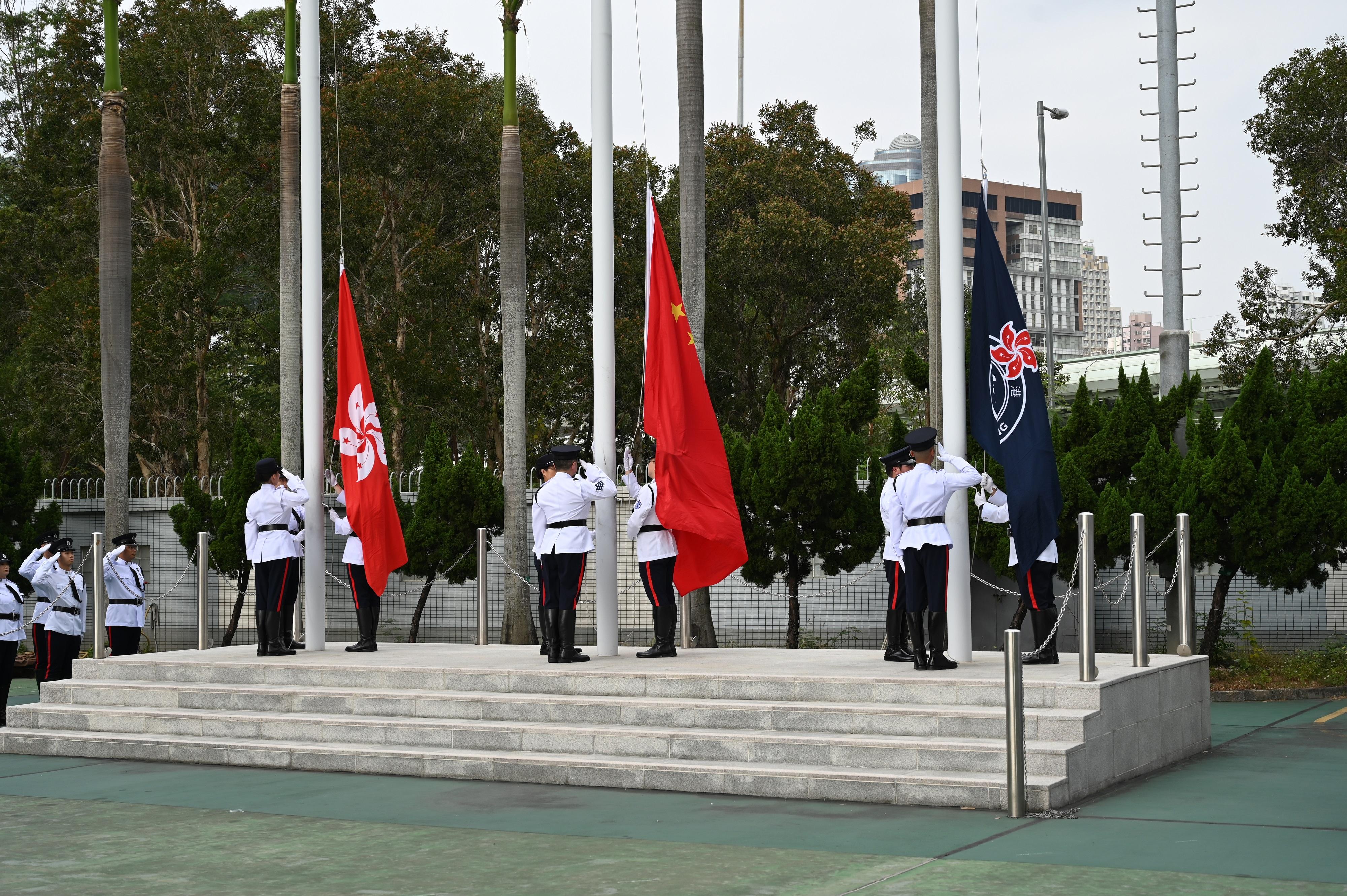 The Civil Aid Service (CAS) held the Passing-out Parade for the 91st Recruits at its headquarters today (December 28). Photo shows the CAS Guard of Honour conducting a flag-raising ceremony.