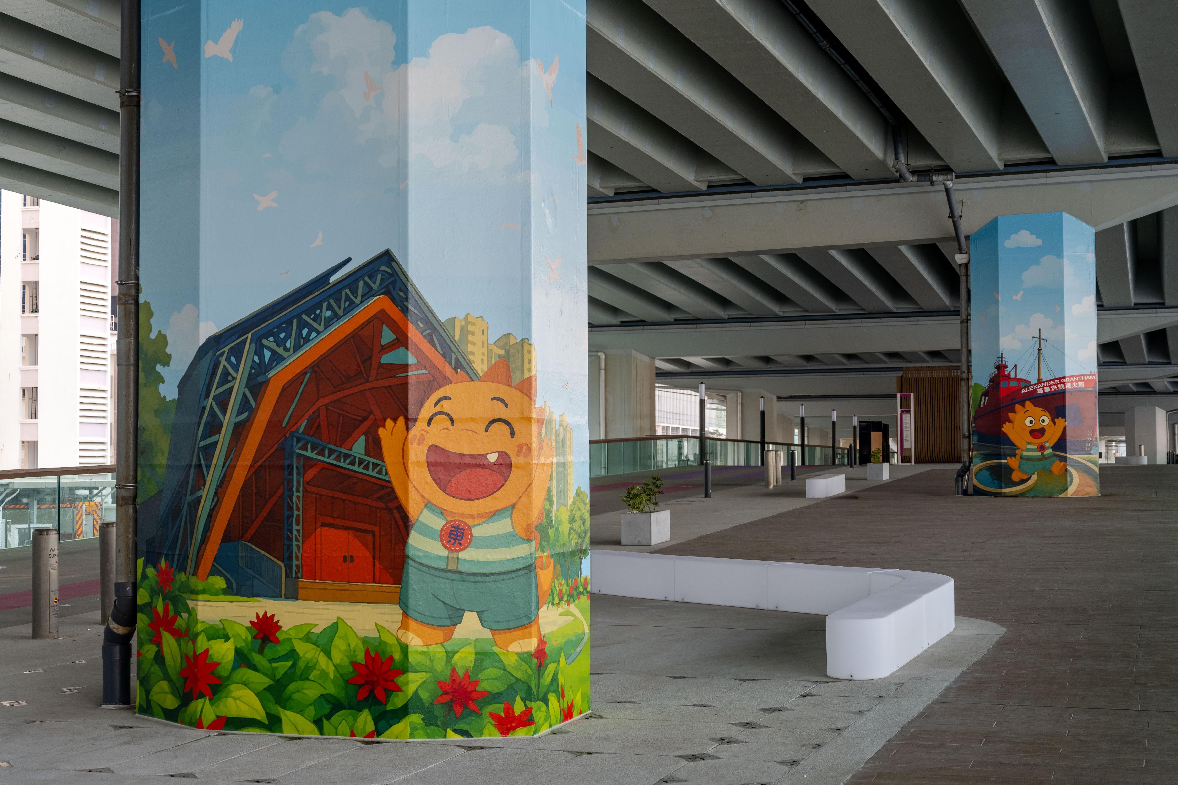 The Eastern Section of the East Coast Boardwalk in North Point will open tomorrow (December 29). Photo shows one of the multi-functional open spaces for hosting exhibitions, art and community activities upon application. Graphics of the Eastern District mascot "Dong Dong" visiting popular attractions in the district by local artists are showcased on the bridge piers.