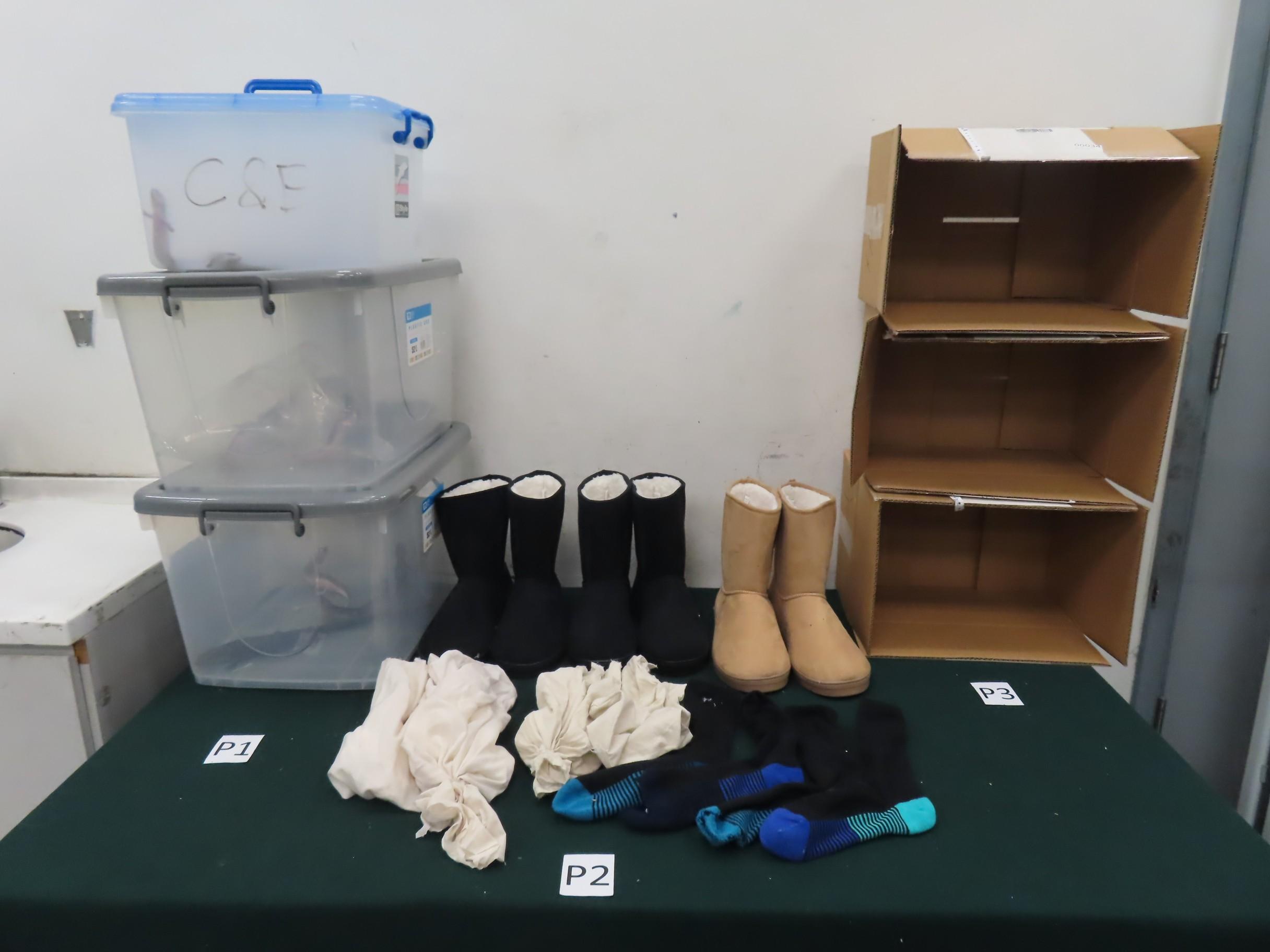 Hong Kong Customs seized 13 suspected scheduled endangered live lizards with an estimated market value of about $92,000 at Hong Kong International Airport on December 27. Photo shows the boots, socks and cloths used to conceal the batch of suspected scheduled endangered live lizards.
