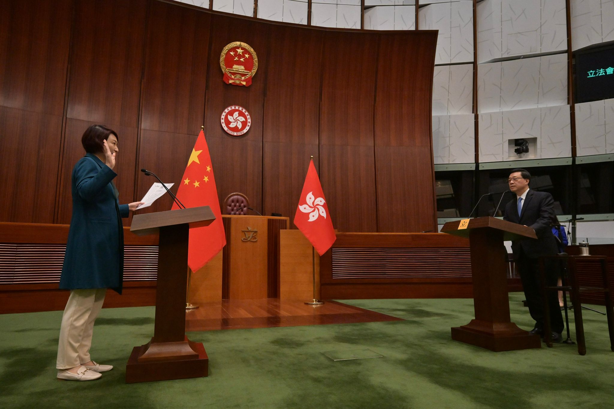 The Chief Executive, Mr John Lee (right), administers the oath-taking of members of the eighth-term Legislative Council (LegCo) at the Chamber of the LegCo Complex today (January 1).