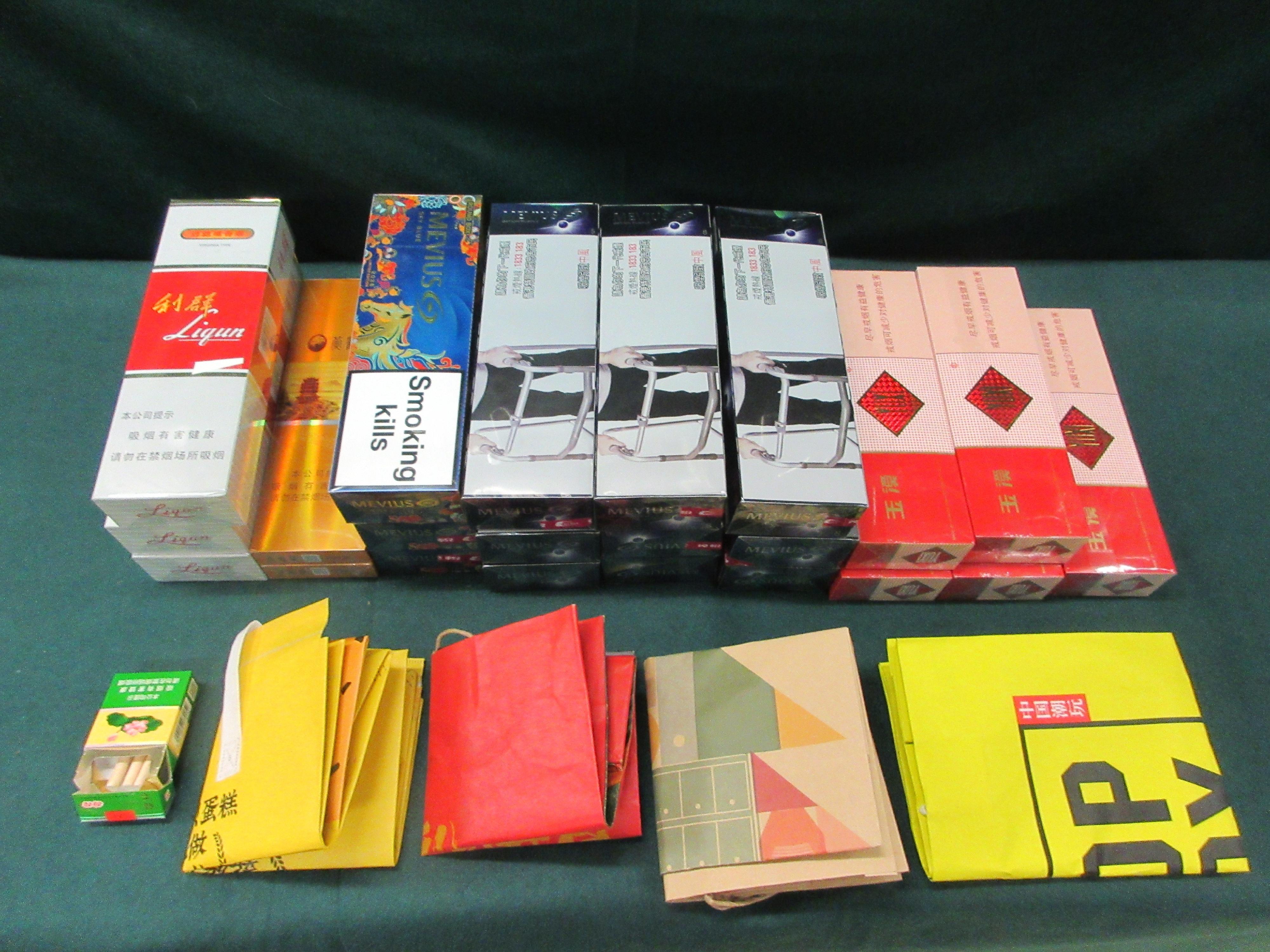 Two incoming passengers were sentenced to two months' and 10 weeks' imprisonment respectively by the Fanling Magistrates' Courts today (January 16) for possessing duty-not-paid cigarettes and failing to declare them to Customs officers, in contravention of the Dutiable Commodities Ordinance. Photo shows some of the duty-not-paid cigarettes seized.