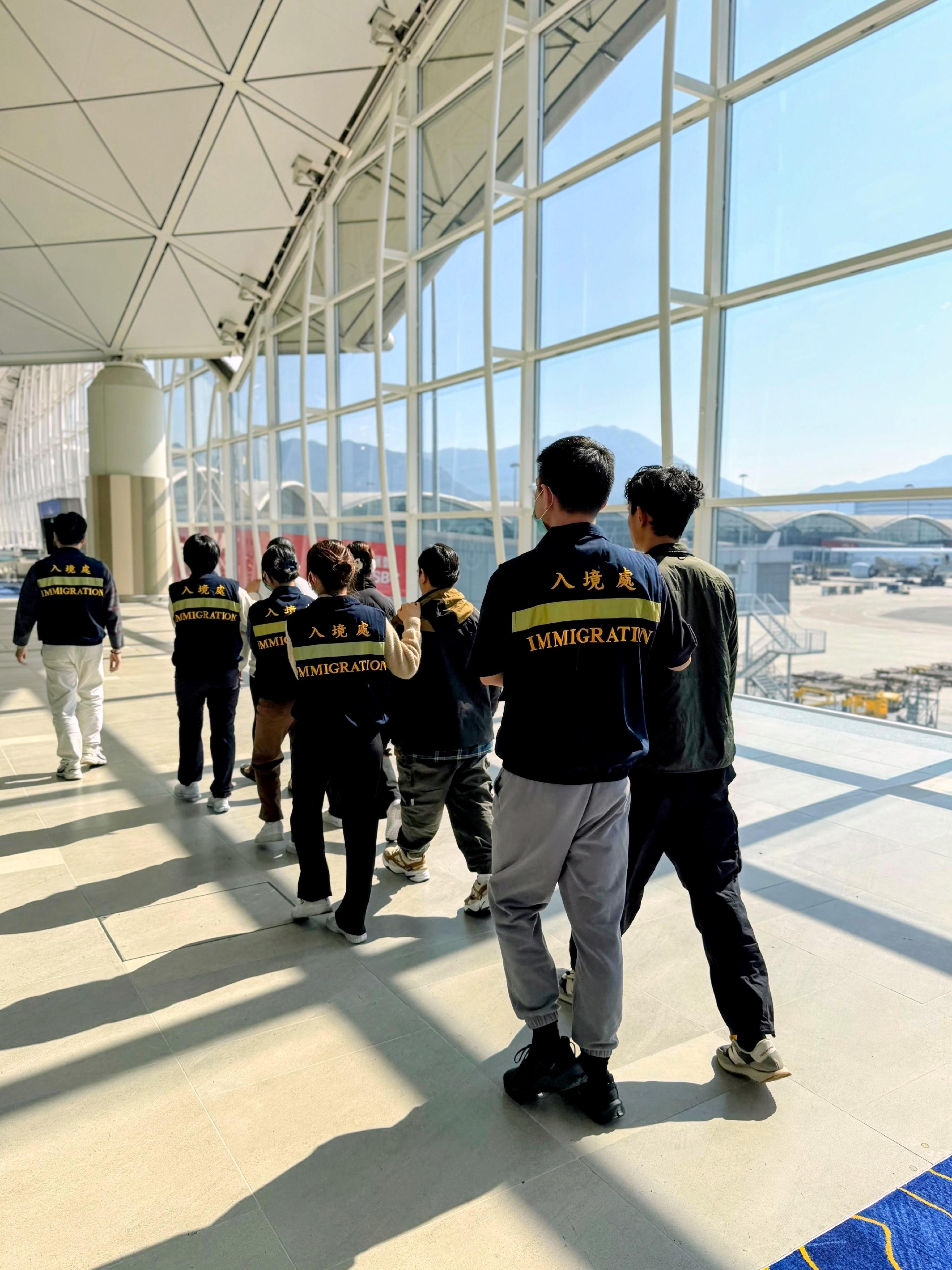 The Immigration Department (ImmD) carried out a repatriation operation codenamed "Shield" for seven consecutive days from January 12 to yesterday (January 18). A total of 113 unsubstantiated non-refoulement claimants were repatriated to their places of origin. Photo shows removees being escorted by ImmD officers to depart from Hong Kong.