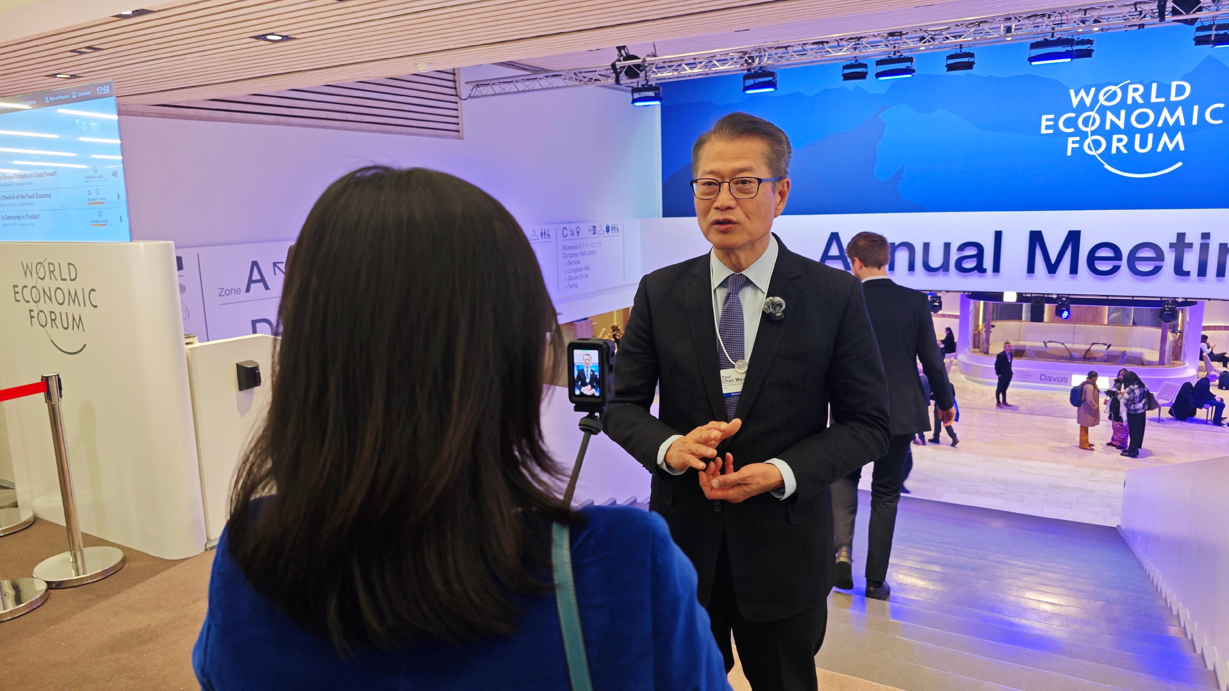 The Financial Secretary, Mr Paul Chan, continued his activities at the World Economic Forum Annual Meeting yesterday (January 22, Davos time). Photo shows Mr Chan (right) giving an interview to the media outlet SINA, in Davos, Switzerland.