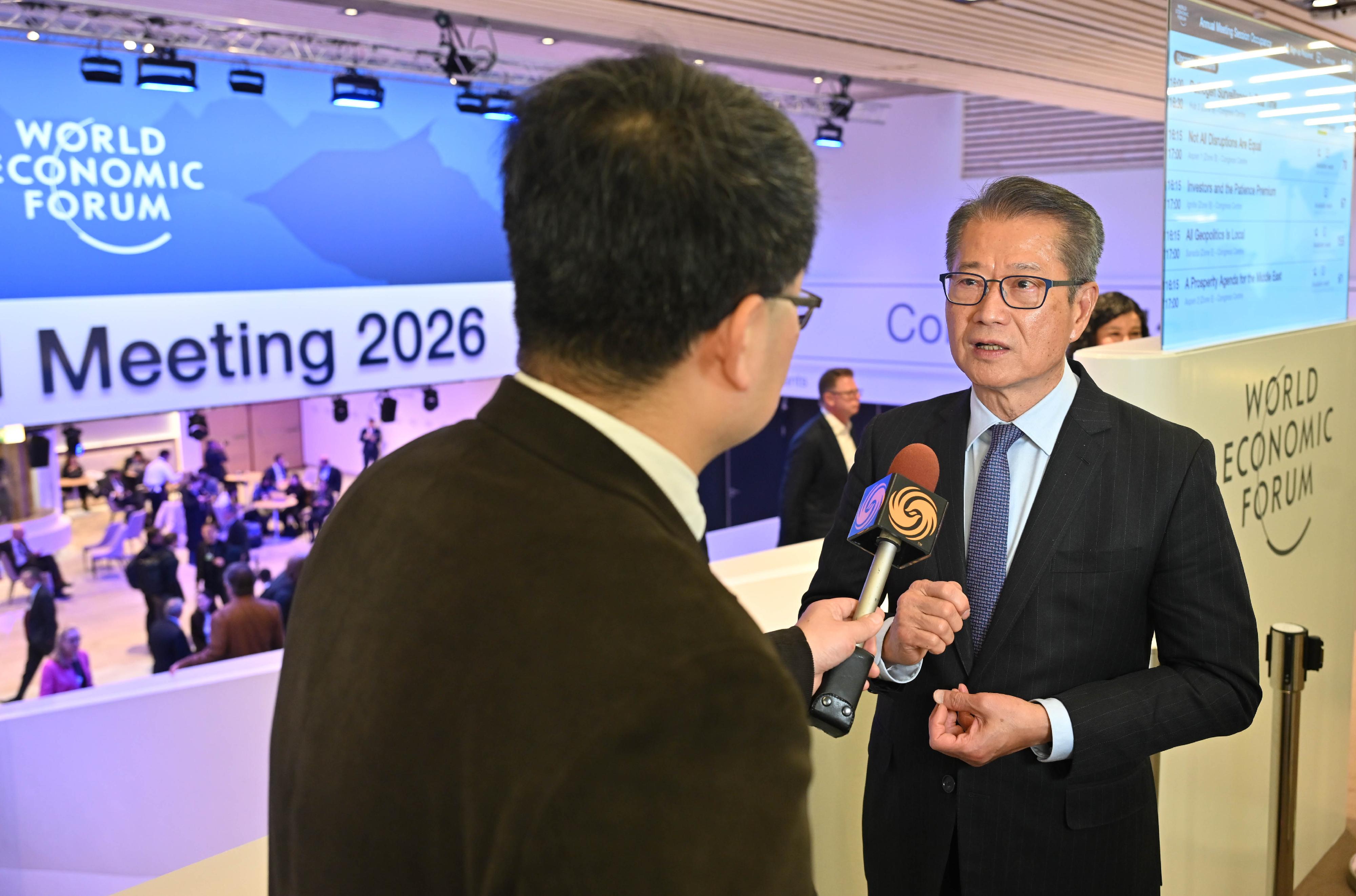 The Financial Secretary, Mr Paul Chan, continued his activities at the World Economic Forum Annual Meeting yesterday (January 22, Davos time). Photo shows Mr Chan (right) giving an interview to the media outlet Phoenix TV, in Davos, Switzerland.