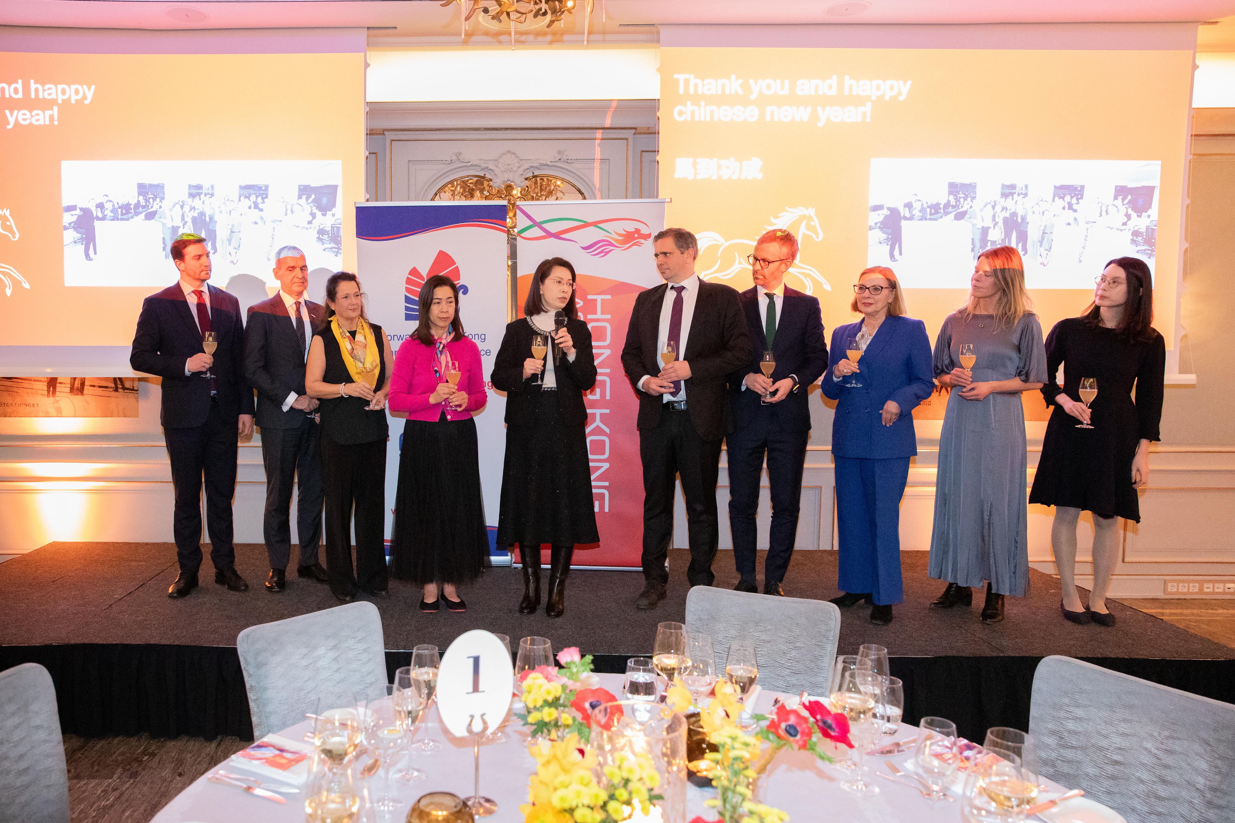 The Hong Kong Economic and Trade Office in London (London ETO) in collaboration with Invest Hong Kong (InvestHK) and the Hong Kong Trade Development Council (HKTDC) hosted two celebratory and promotional events to celebrate the Year of the Horse in Stockholm, Sweden, and Oslo, Norway, on January 21 and 22 respectively. Photo shows the Ambassador Extraordinary and Plenipotentiary and Head of Mission of the People's Republic of China to the Kingdom of Norway, Ms Hou Yue (fifth left); the Director-General of the London ETO, Miss Fiona Chau (fourth left); the representative of the Ministry of Foreign Affairs in Norway, Jens Reinertsen (fourth right); the Executive Secretary of the Norway-Hong Kong Chamber of Commerce, Ms Cathrine Jahnsen (third left); Nordic Consultant of the InvestHK, Mr Mats Gerlam (second left); the Marketing Manager of the HKTDC (London Office), Ms Rachel Fung (first right); and other esteemed guests toasting at the Oslo reception.