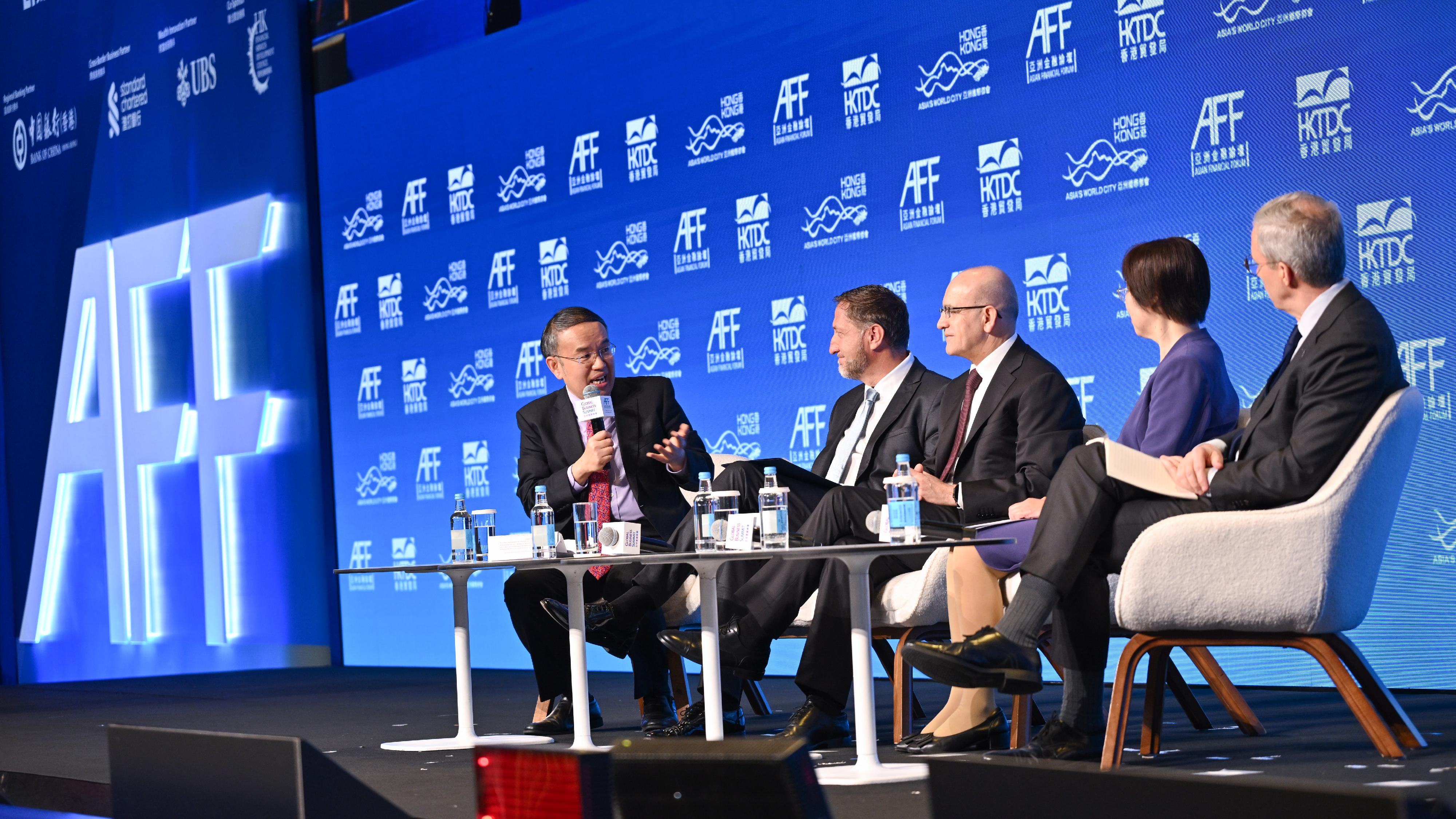 The Secretary for Financial Services and the Treasury, Mr Christopher Hui (first left), chairs the plenary session themed "Fostering Co-operation for Shared Success" at the Asian Financial Forum this morning (January 26), to discuss with Deputy Prime Minister and Minister for Finance of Slovenia, Mr Klemen Boštjančič (second left); the Minister of Treasury and Finance of Türkiye, Mr Mehmet Şimşek (third left); the President of the Asian Infrastructure Investment Bank, Ms Zou Jiayi (second right); and the Vice-President (East and Southeast Asia, and the Pacific) of Asian Development Bank, Mr Scott Morris (first right), how to strengthen communication and dialogue among economies and pursue shared development amid the evolving global political and economic landscape.