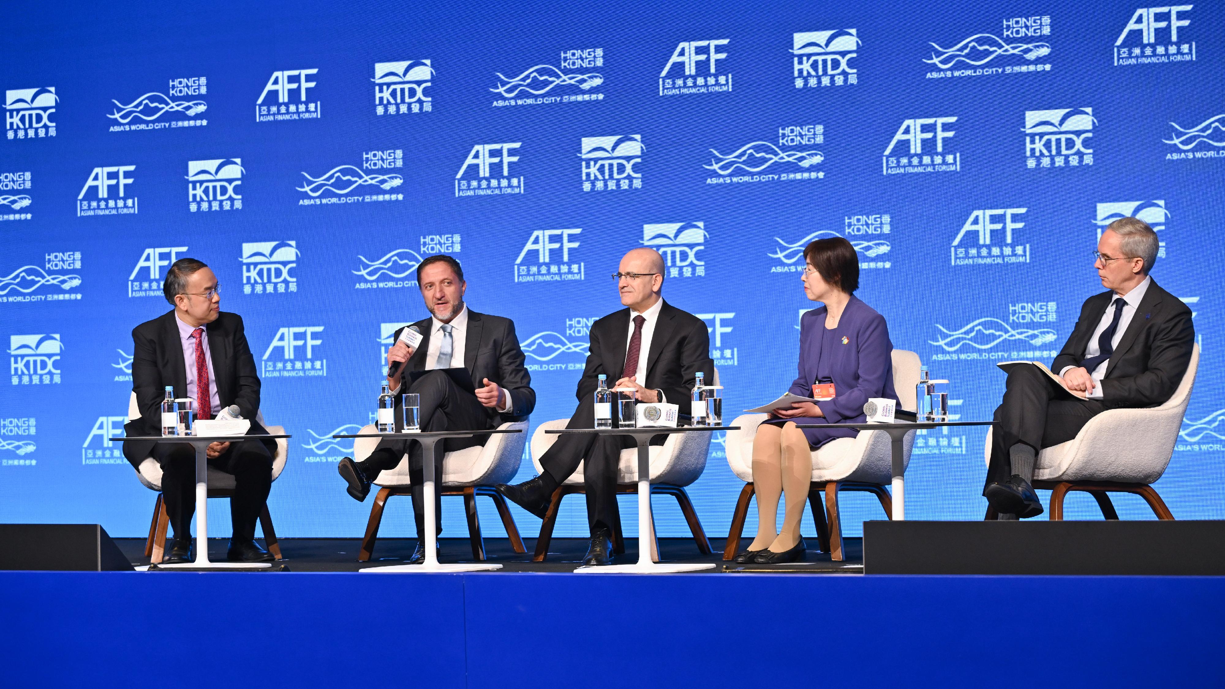 The Secretary for Financial Services and the Treasury, Mr Christopher Hui (first left), chairs the plenary session themed "Fostering Co-operation for Shared Success" at the Asian Financial Forum this morning (January 26), to discuss with Deputy Prime Minister and Minister for Finance of Slovenia, Mr Klemen Boštjančič (second left); the Minister of Treasury and Finance of Türkiye, Mr Mehmet Şimşek (third left); the President of the Asian Infrastructure Investment Bank, Ms Zou Jiayi (second right); and the Vice-President (East and Southeast Asia, and the Pacific) of Asian Development Bank, Mr Scott Morris (first right), how to strengthen communication and dialogue among economies and pursue shared development amid the evolving global political and economic landscape.