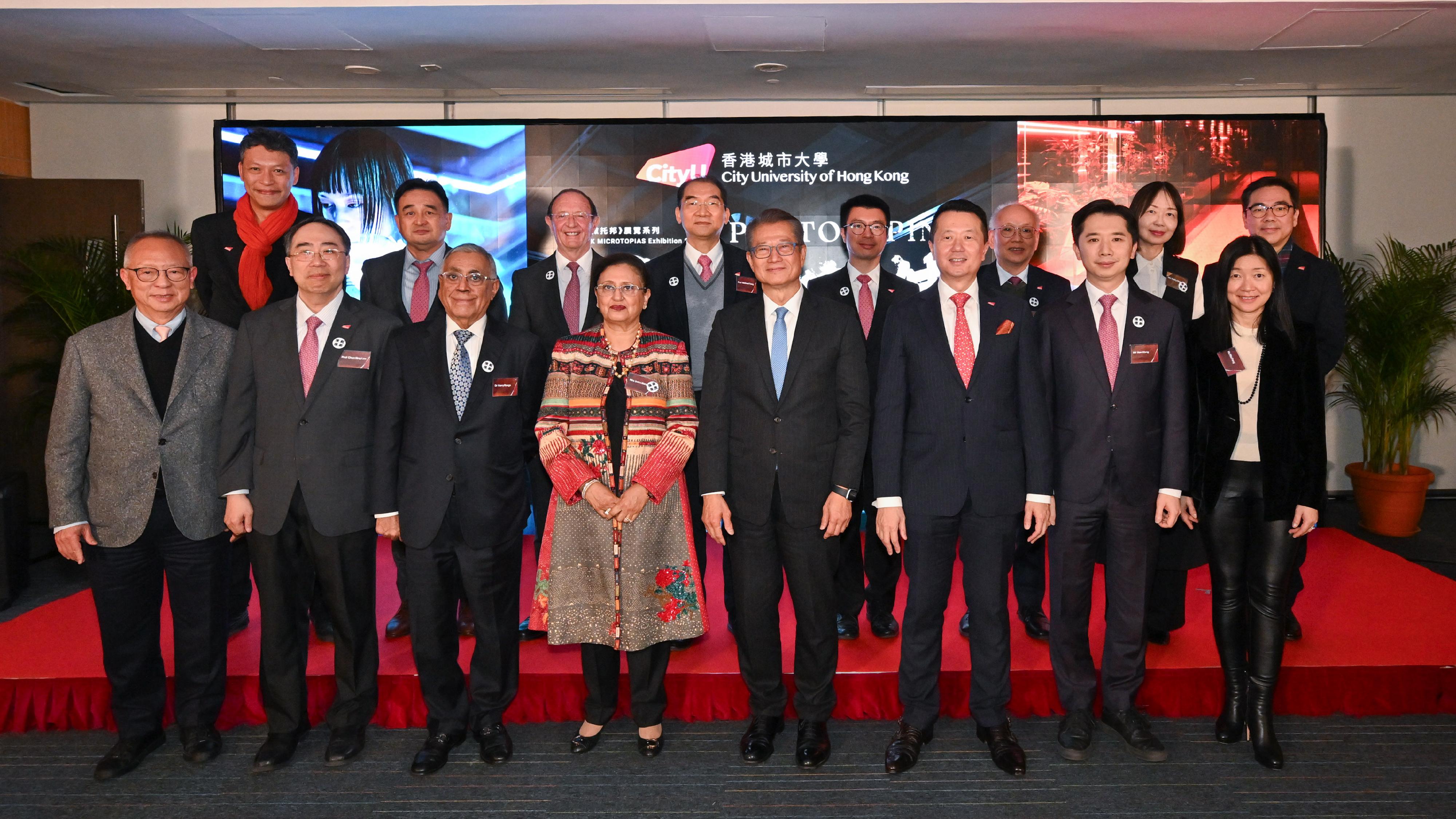 The Financial Secretary, Mr Paul Chan, attended the Prototyping: Exhibition Opening cum Kick-off of the 10th Anniversary of the Indra and Harry Banga Gallery today (January 28). Photo shows (front row, from second left) the Provost and Deputy President of City University of Hong Kong, Professor Lee Chun-sing; Founding Patrons of the Indra and Harry Banga Gallery, Dr Harry Banga and Mrs Indra Banga; Mr Chan; the Council Chairman of City University of Hong Kong, Professor Michael Ngai, and other guests at the ceremony.
