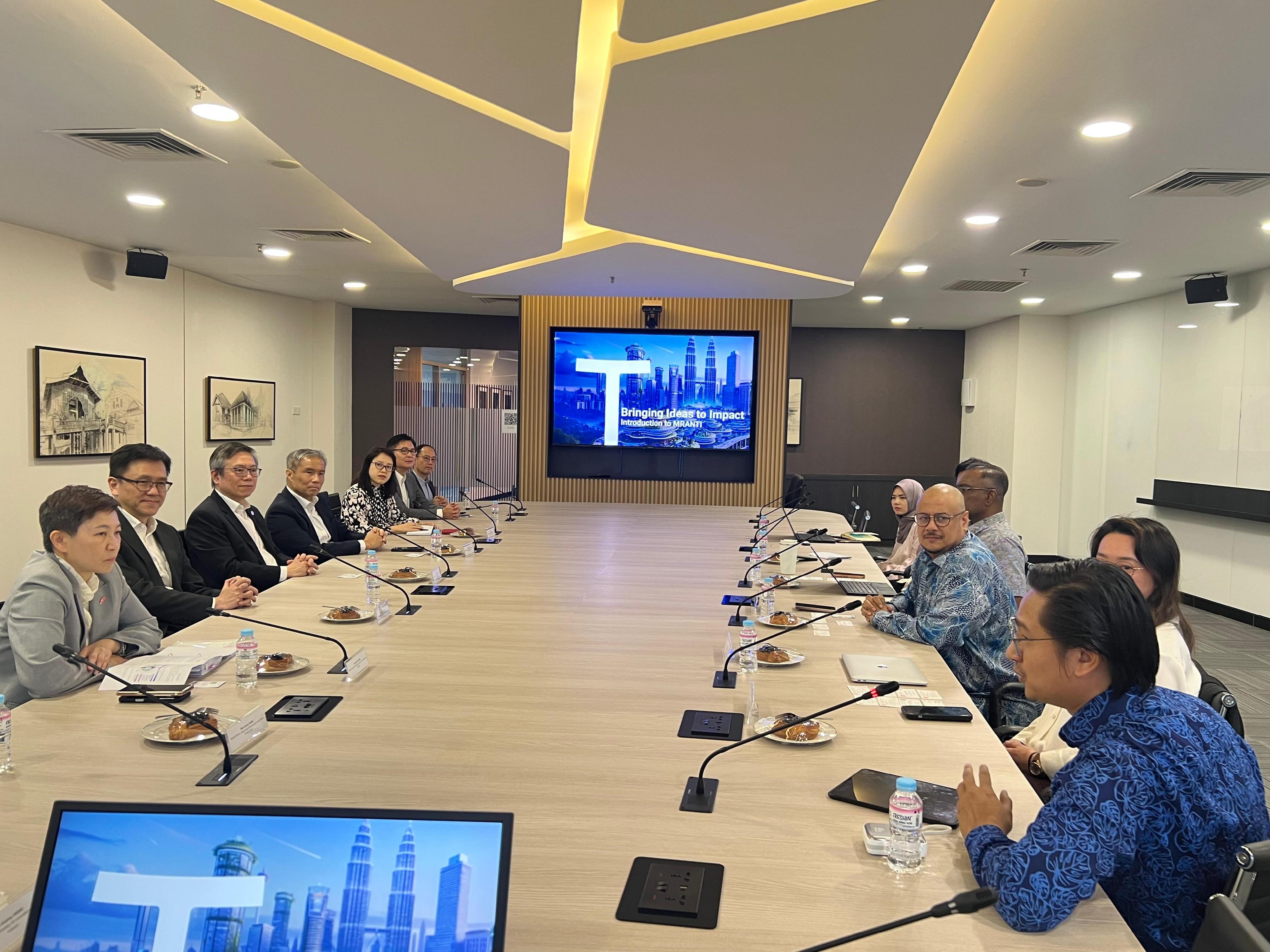 The Secretary for Innovation, Technology and Industry, Professor Sun Dong (second left), visited the Malaysian Research Accelerator for Technology and Innovation (MRANTI) in Kuala Lumpur yesterday (January 29) and was briefed on the innovation ecosystem built by MRANTI locally. Also present with Professor Sun are the Chief Executive Officer of the Hong Kong Science and Technology Parks Corporation, Mr Terry Wong (third left), and the Chief Executive Officer of the Hong Kong-Shenzhen Innovation and Technology Park Limited, Mr Vincent Ma (fourth left).