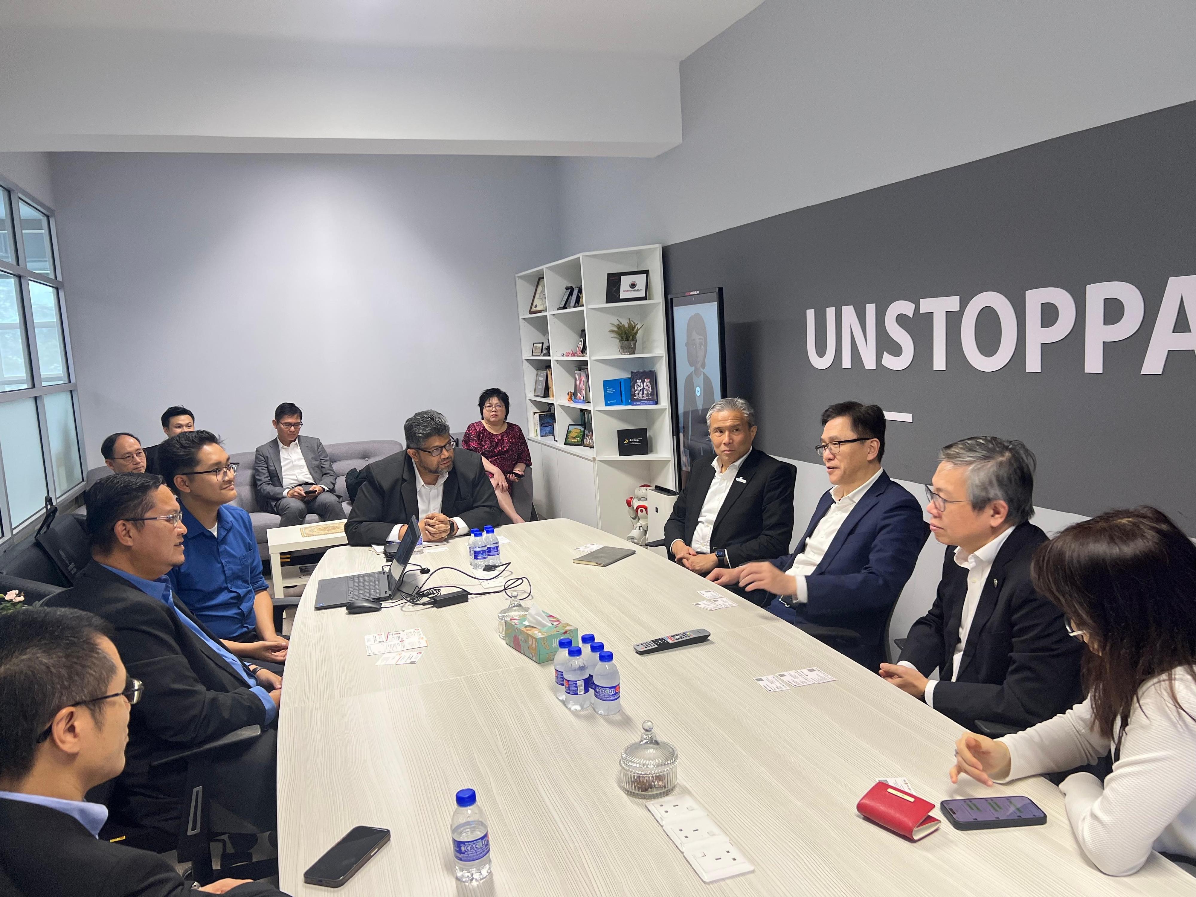 The Secretary for Innovation, Technology and Industry, Professor Sun Dong (third right) visited a service-robotics enterprise in Kuala Lumpur today (January 30) to learn about its business focusing on designing and developing customised robotics products and solutions. Also present with Professor Sun are the Chief Executive Officer of the Hong Kong Science and Technology Parks Corporation, Mr Terry Wong (second right), and the Chief Executive Officer of the Hong Kong-Shenzhen Innovation and Technology Park Limited, Mr Vincent Ma (fourth right).