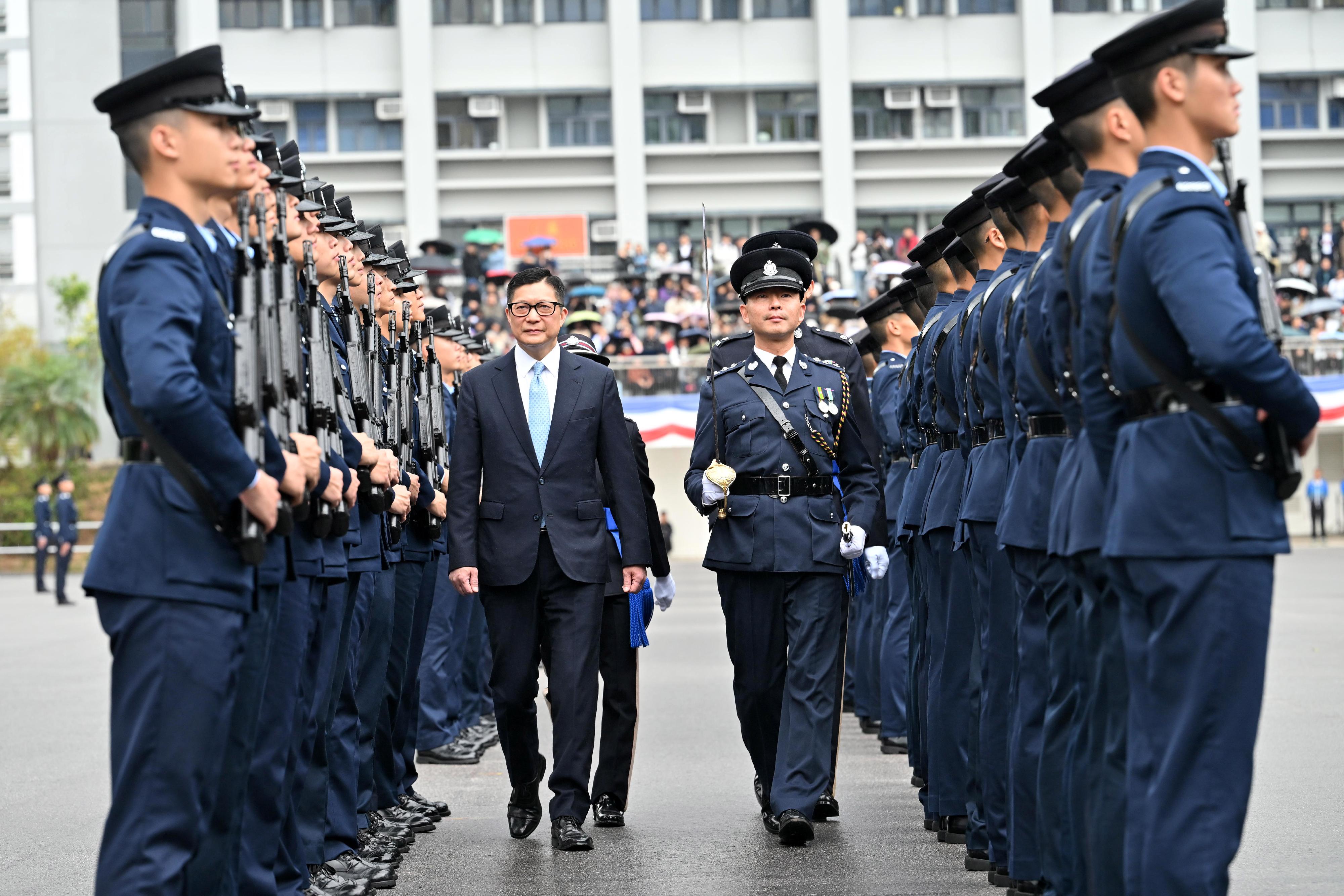 The Secretary for Security, Mr Tang Ping-keung, inspects a passing-out parade as reviewing officer at the Hong Kong Police College today (January 31).