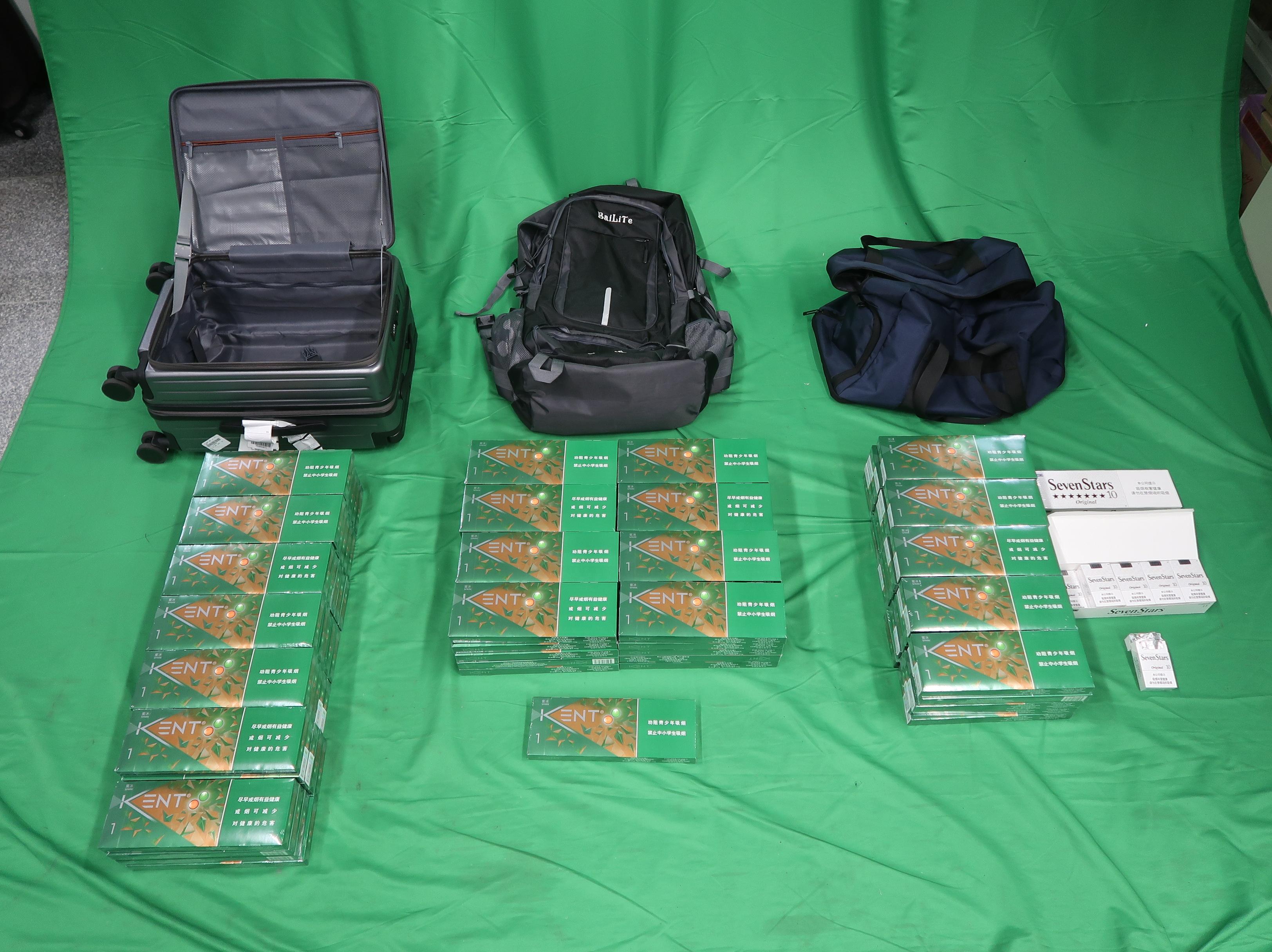 An incoming male passenger was sentenced to four months' imprisonment and fined $500 by the West Kowloon Magistrates' Courts today (February 2) for importing duty-not-paid cigarettes and failing to declare them to Customs officers, in contravention of the Dutiable Commodities Ordinance. Photo shows the duty-not-paid cigarettes seized from the personal baggage of the 41-year-old passenger.