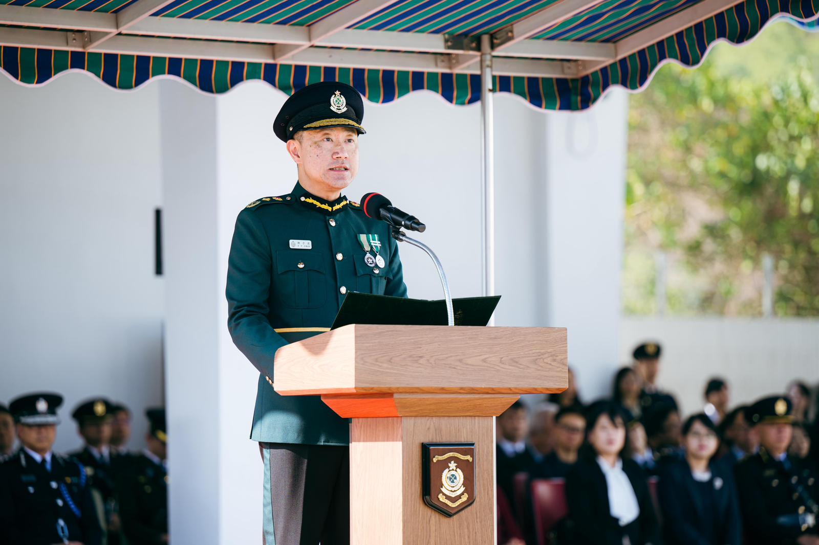 The Commissioner of Customs and Excise, Mr Chan Tsz-tat, delivers a speech at the Hong Kong Customs Passing-out Parade today (February 6).