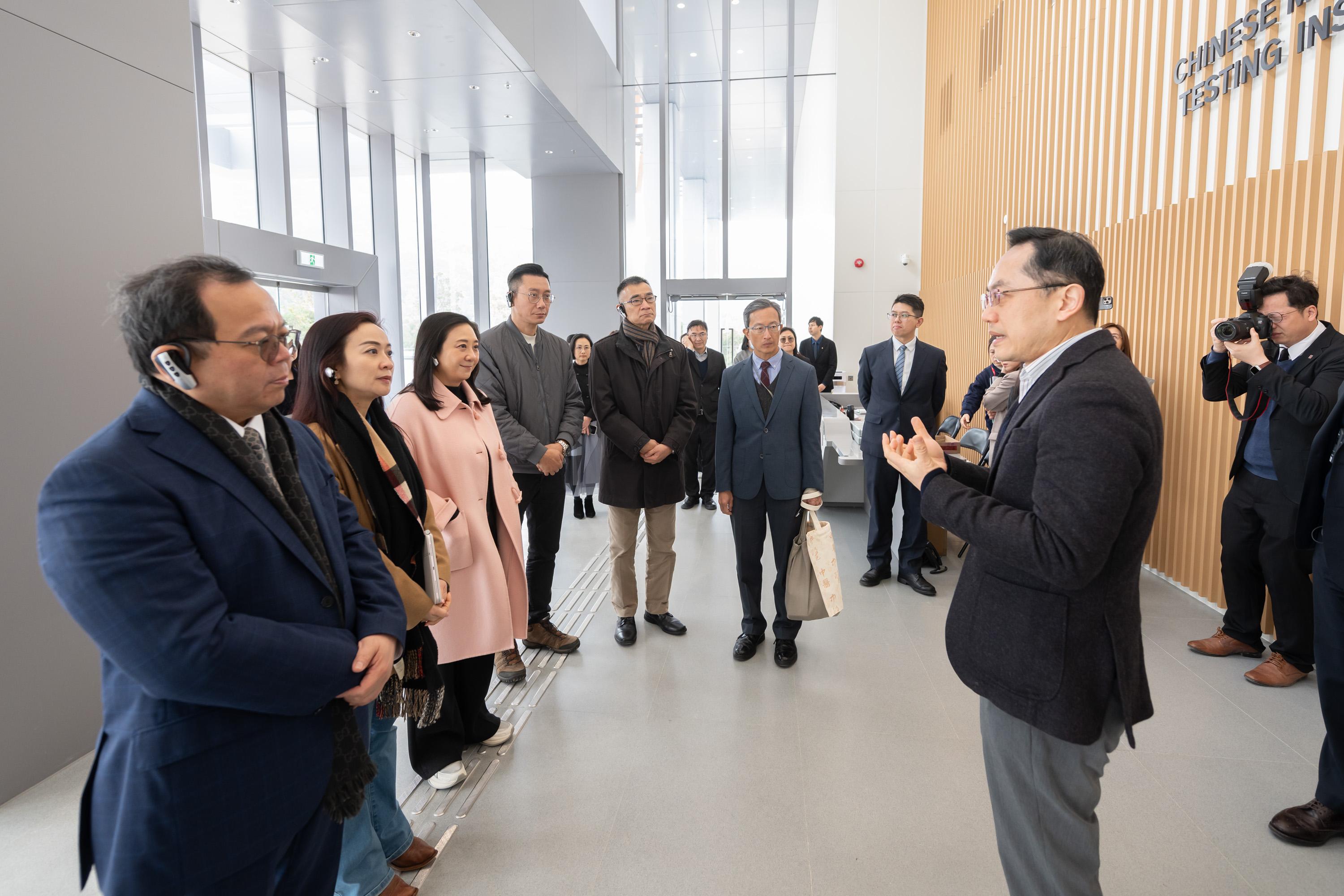 The Legislative Council Panel on Health Services visits The Chinese Medicine Hospital of Hong Kong and the Government Chinese Medicines Testing Institute (GCMTI) today (February 9). Photo shows Members receiving a briefing by the Director of Health, Dr Ronald Lam (first left), on the permanent premises of the GCMTI.