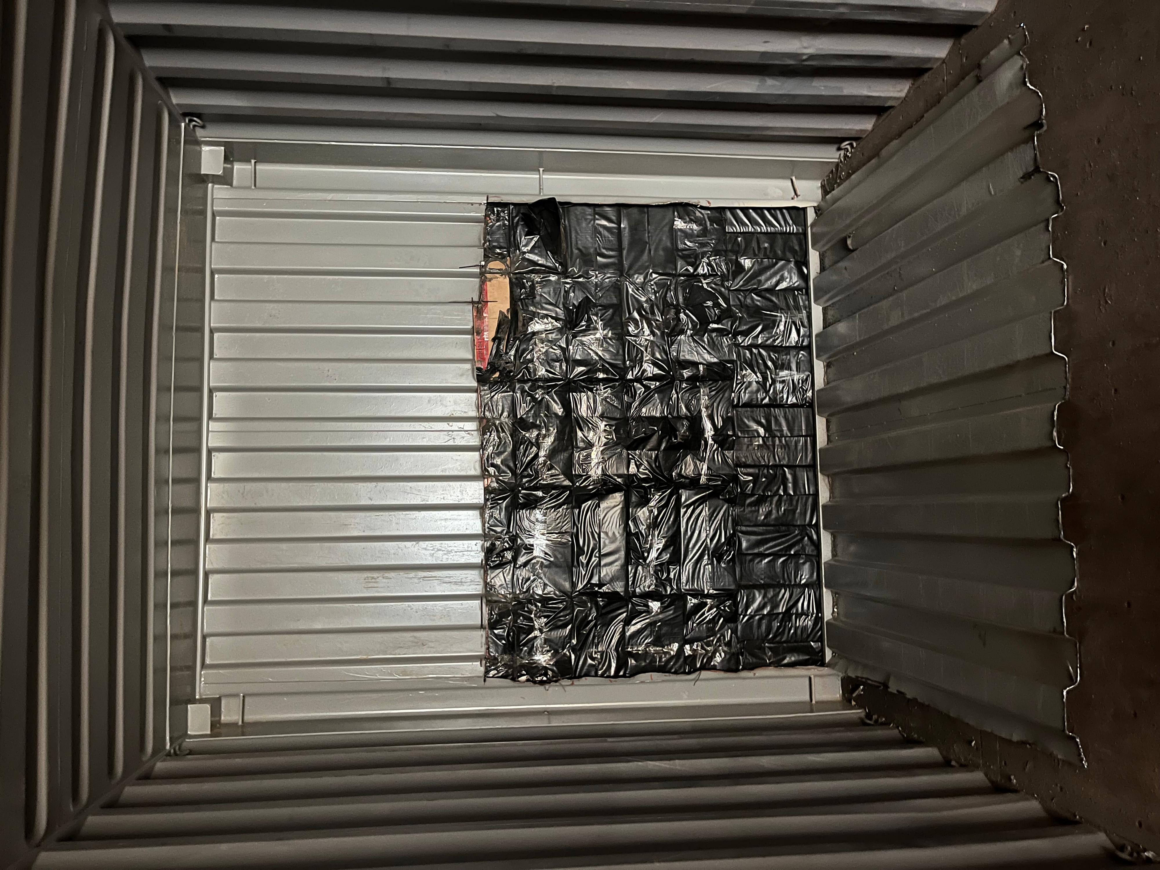 Hong Kong Customs recently mounted enforcement operations targeting large-scale illicit cigarette smuggling activities by sea and detected two cases on January 31 and February 4, during which a total of about 15.22 million suspected illicit cigarettes with an estimated market value of about $68 million and a duty potential of about $50 million were seized. Eight men were arrested. Photo shows the suspected illicit cigarettes seized inside the false compartment built within the container of the ocean-going cargo vessel intercepted by Customs on January 31.