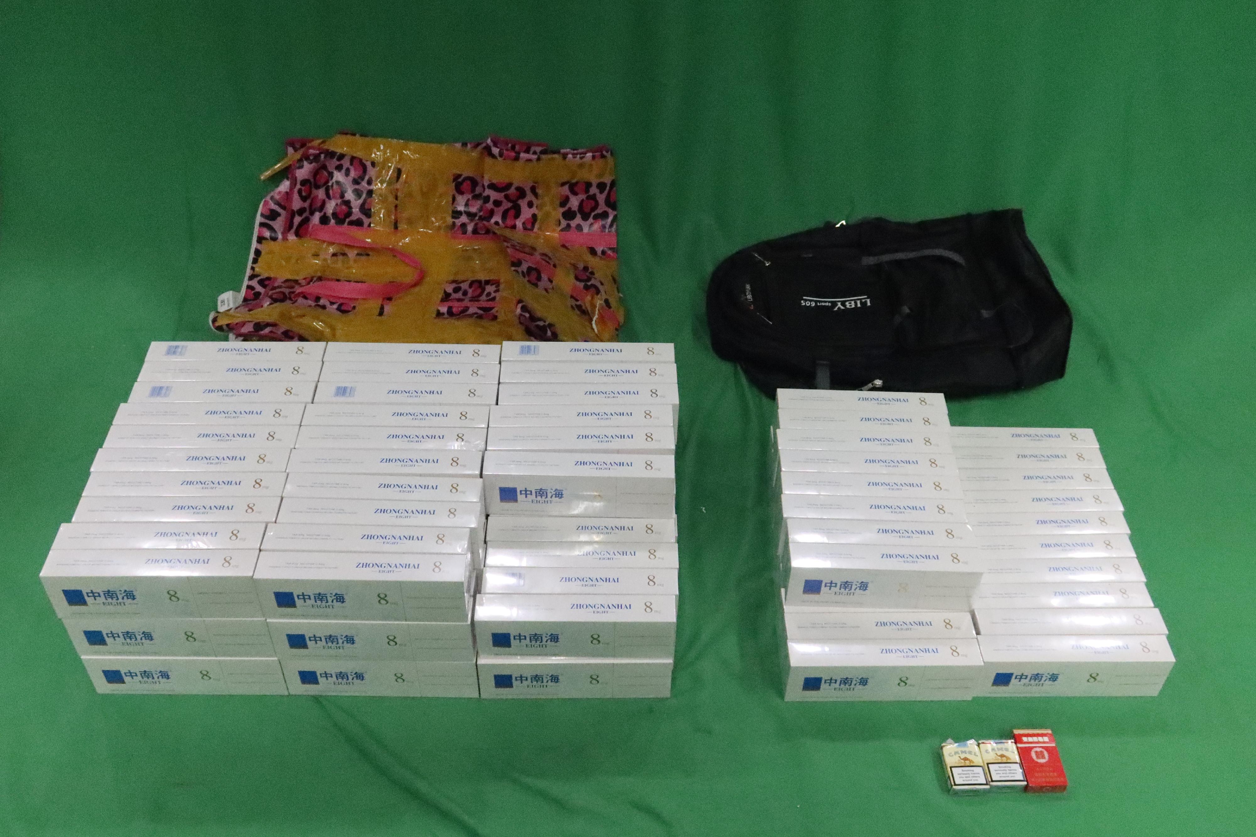 An incoming male passenger was sentenced to three months' imprisonment and fined $1,000 by the West Kowloon Magistrates' Courts today (February 11) for possessing duty-not-paid cigarettes and failing to declare them to Customs officers, in contravention of the Dutiable Commodities Ordinance. Photo shows the duty-not-paid cigarettes seized from the personal baggage of the 33-year-old male passenger. 


