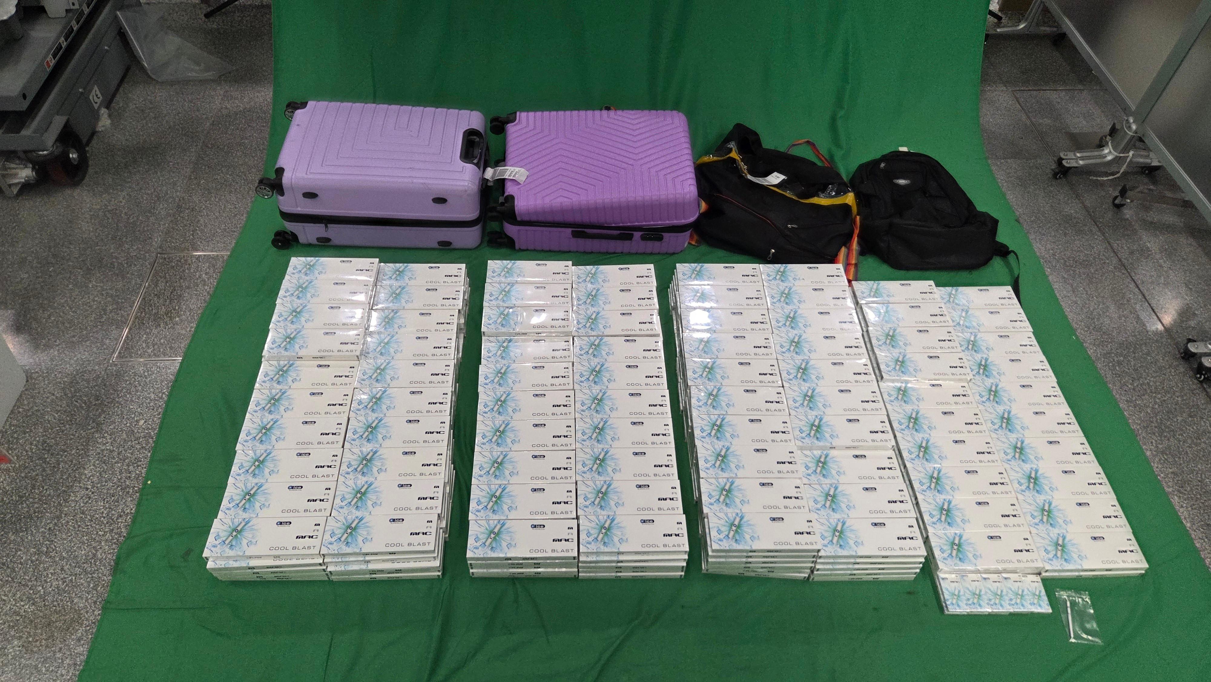 Two incoming passengers were sentenced to five months' and six months' imprisonment and fined $1,000 respectively by the West Kowloon Magistrates' Courts today (February 16) for dealing with and possessing duty-not-paid cigarettes and failing to declare them to Customs officers, in contravention of the Dutiable Commodities Ordinance. Photo shows the duty-not-paid cigarettes seized from the personal baggage of a 42-year-old female passenger. 
