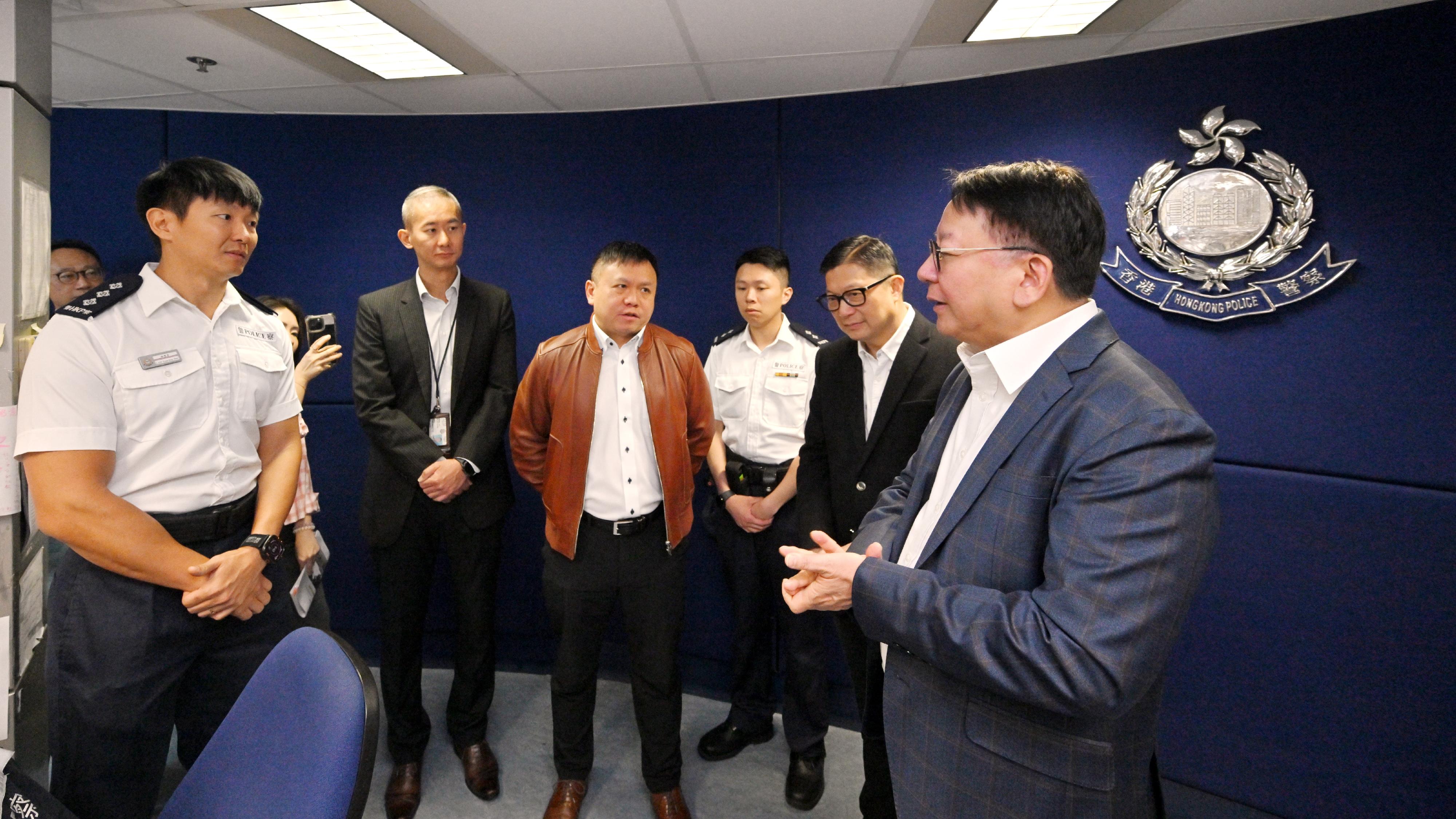 The Chief Secretary for Administration, Mr Chan Kwok-ki (first right), accompanied by the Secretary for Security, Mr Tang Ping-keung (second right) inspects the Lok Ma Chau Spur Line Control Point as he receives a briefing from staff of the Hong Kong Police Force today (February 17), the first day of the Chinese New Year. He also thanked all the colleagues on duty during the Chinese New Year holidays.