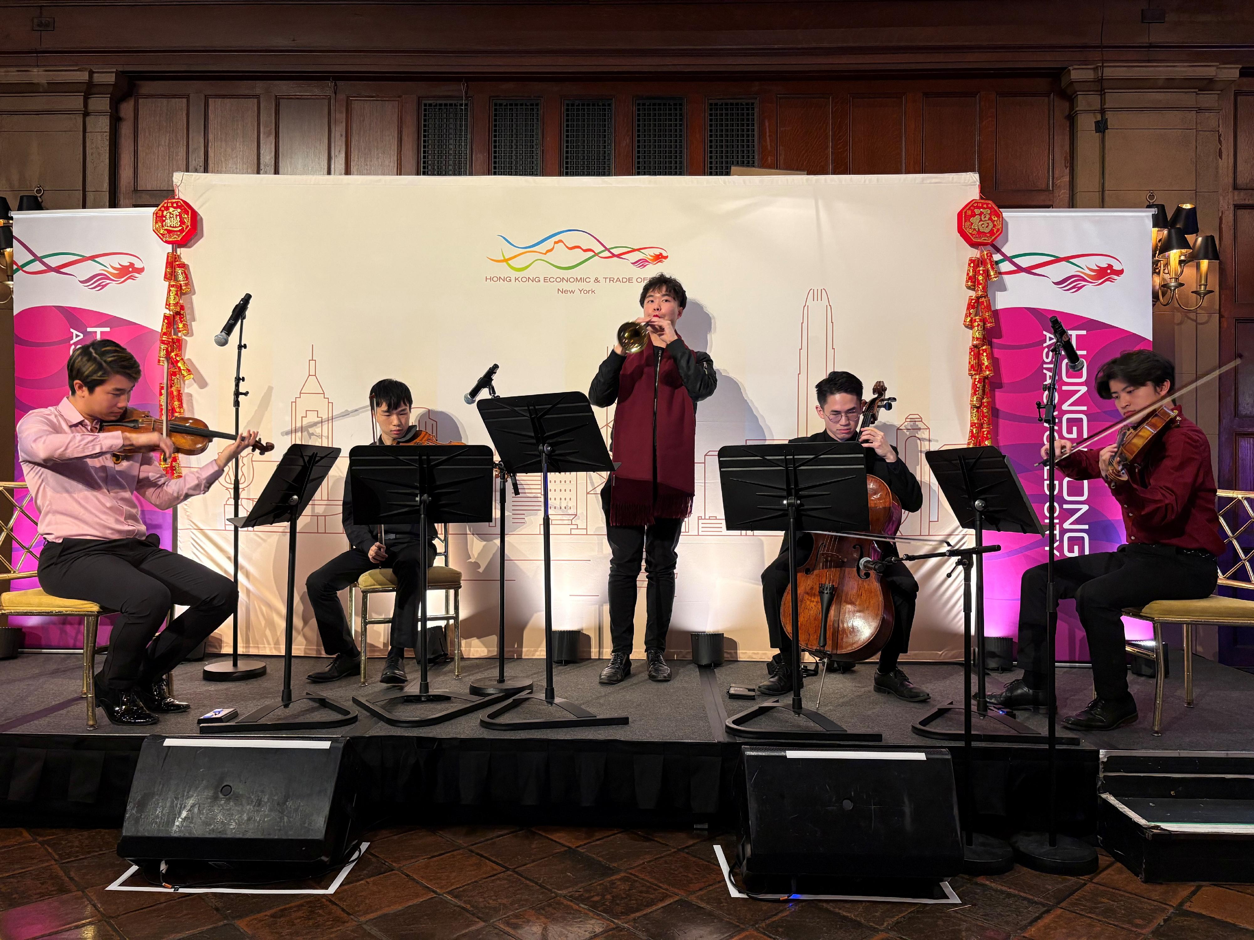 The Hong Kong Economic and Trade Office in New York welcomed the Year of the Horse at its annual Hong Kong Spring Reception in New York on February 18 (New York time).  Photo shows talented New York-based young musicians from Hong Kong performing pieces composed by renowned Hong Kong composer Elliot Leung, blending elements of Chinese New Year, the Year of the Horse and Western instruments, at the reception.