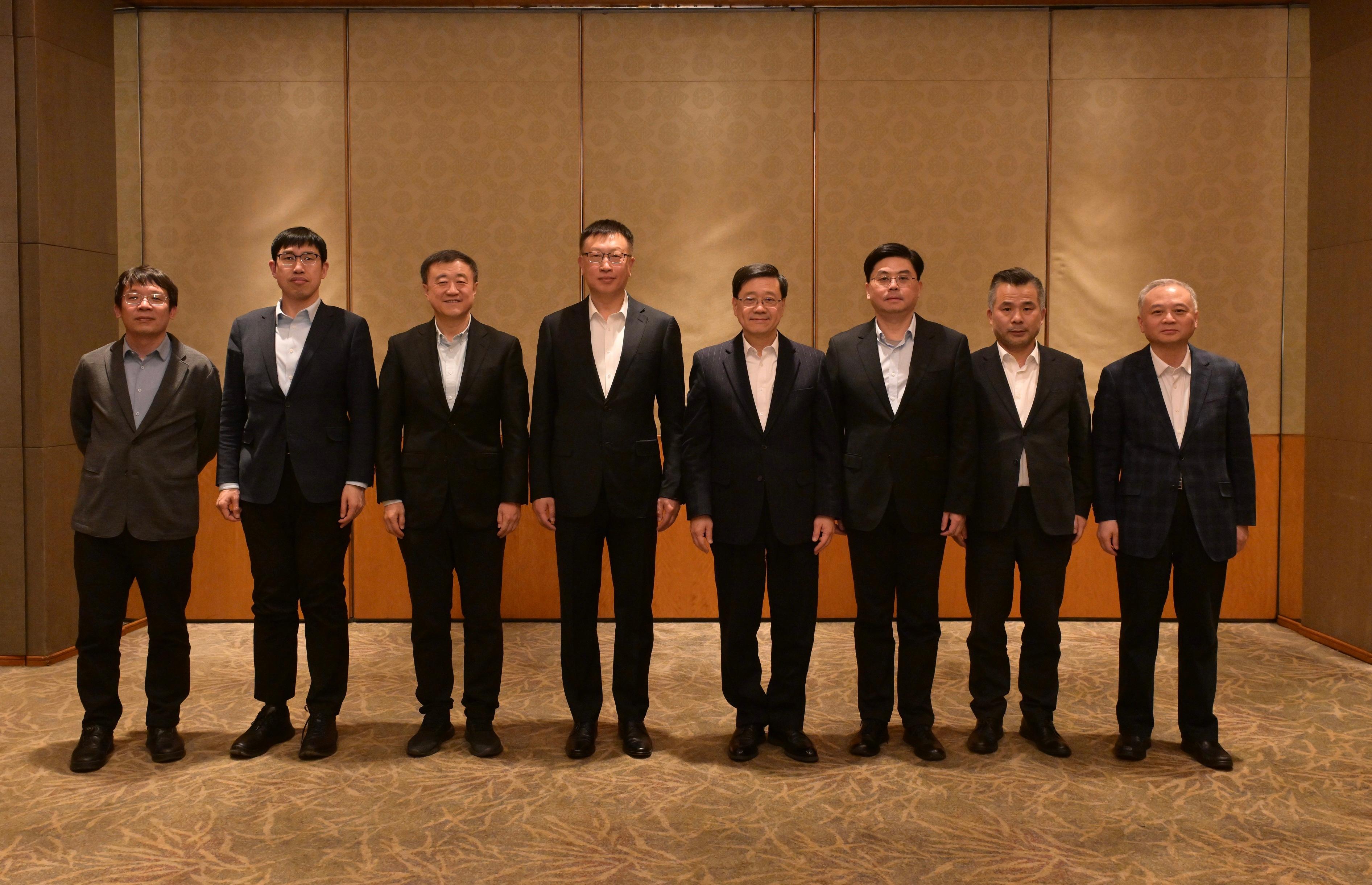 The Chief Executive, Mr John Lee (fourth right), meets leaders of universities in Beijing today (March 4).