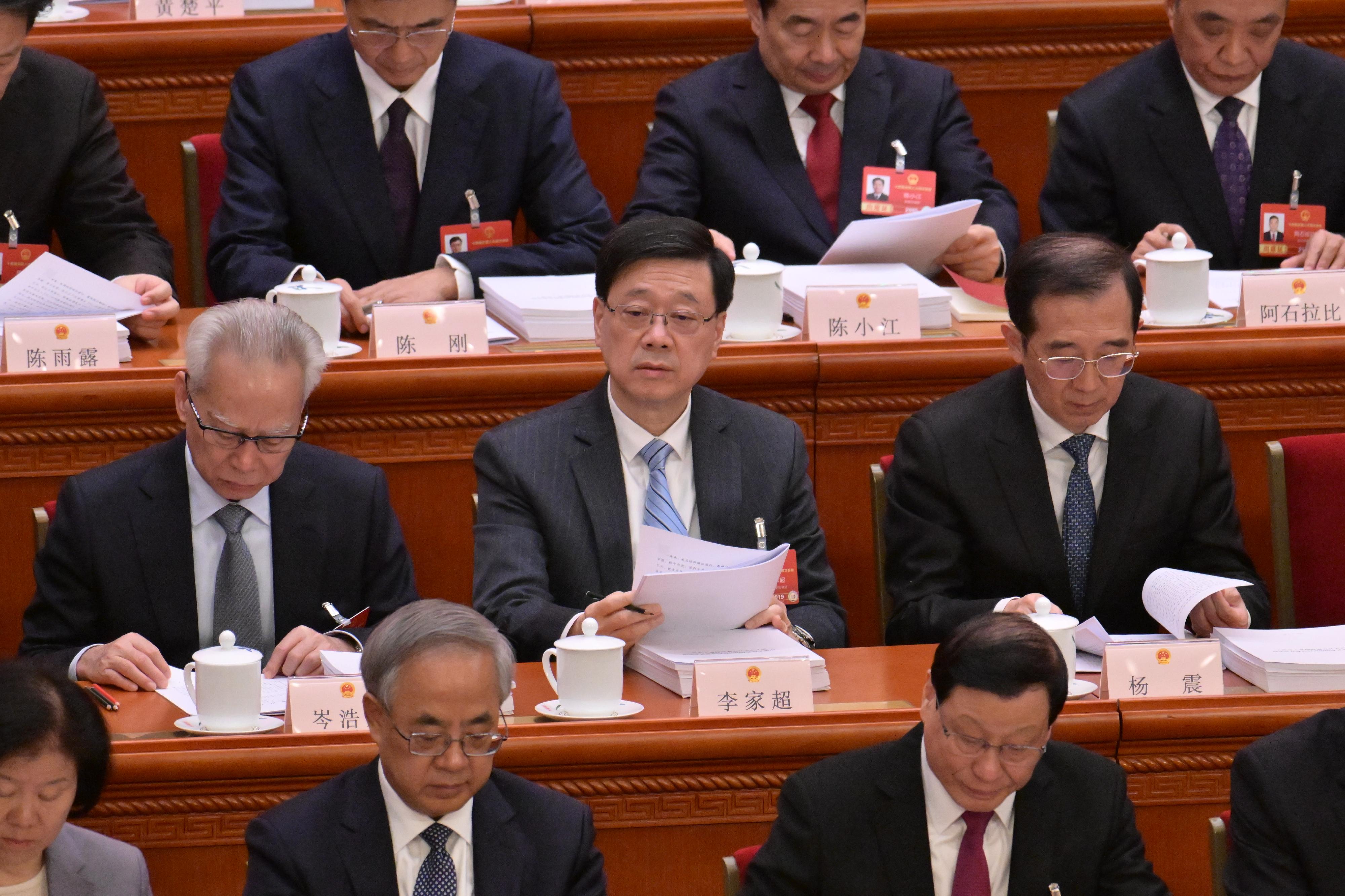 The Chief Executive, Mr John Lee (second row, centre), attends the opening meeting of the fourth annual session of the 14th National People's Congress in Beijing today (March 5).