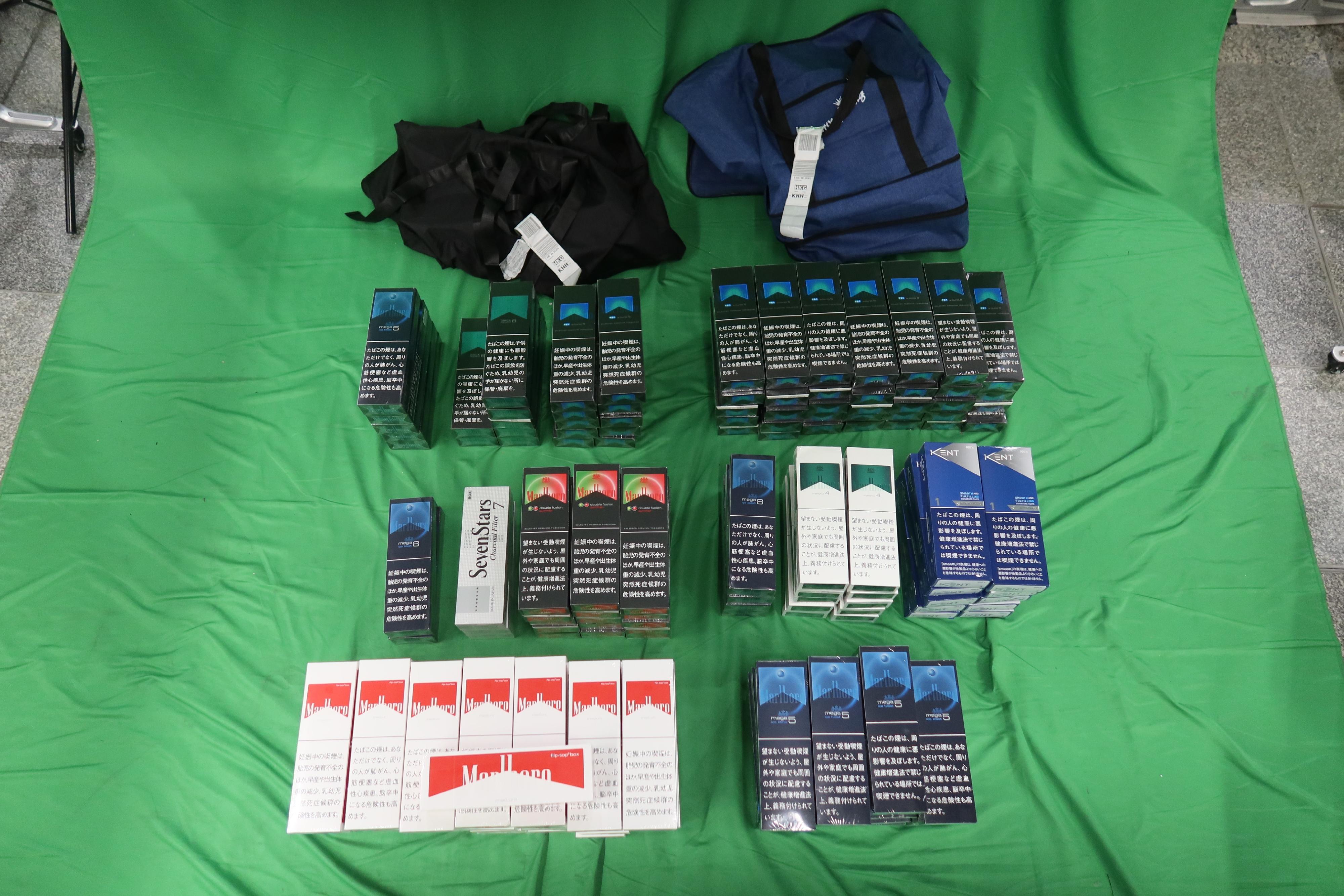 An incoming male passenger was sentenced to five months' imprisonment and fined $1,000 at the West Kowloon Magistrates' Courts today (March 5) for dealing with duty-not-paid cigarettes and failing to declare them to Customs officers, in contravention of the Dutiable Commodities Ordinance. Photo shows the duty-not-paid cigarettes seized.