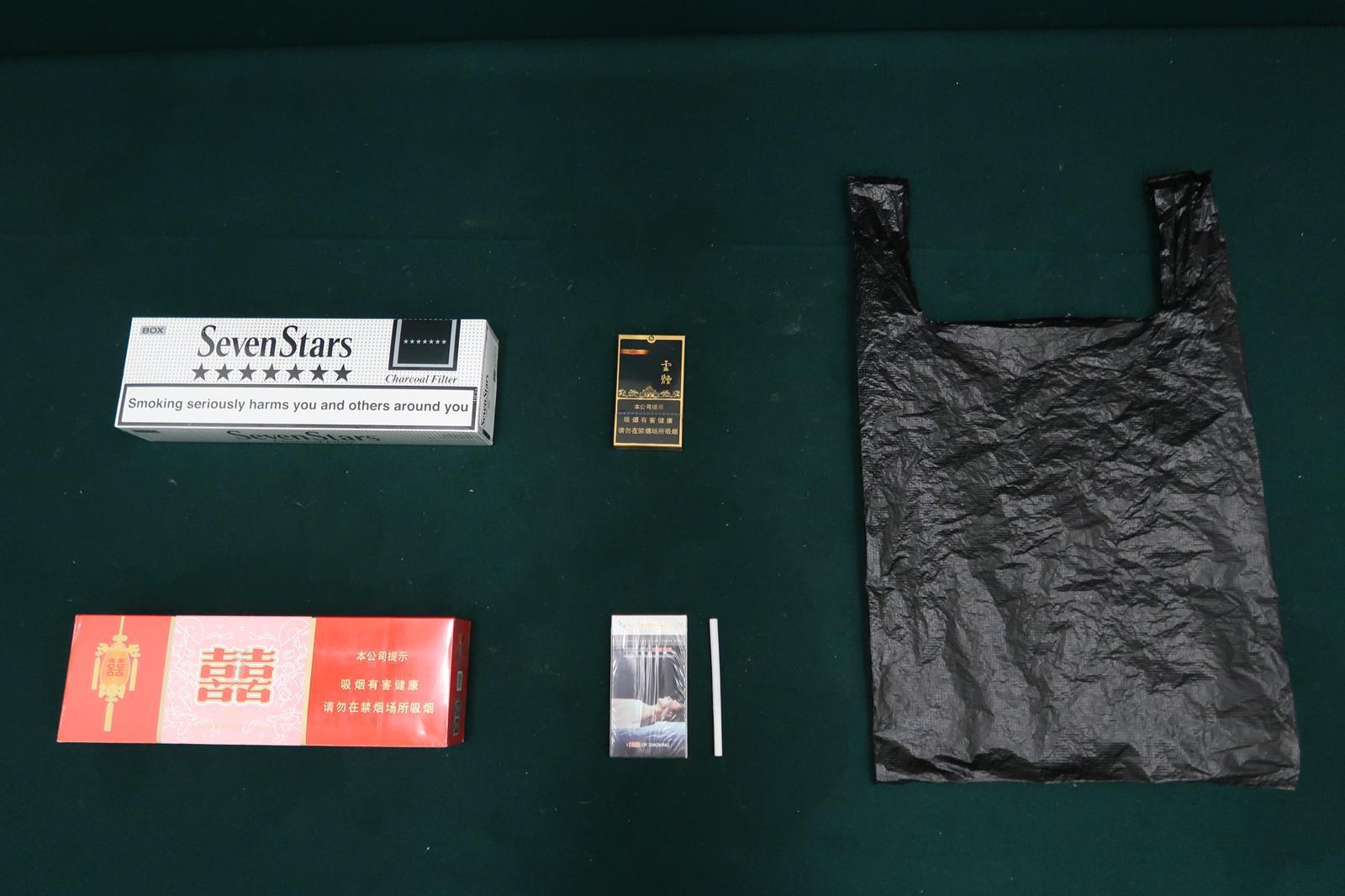 Two incoming passengers were sentenced to nine weeks' imprisonment and six weeks' imprisonment and fined $2,000 respectively by the Fanling Magistrates' Courts today (March 5) for possessing duty-not-paid cigarettes and failing to declare them to Customs officers, in contravention of the Dutiable Commodities Ordinance. Photo shows the duty-not-paid cigarettes seized from the personal baggage of a 60-year-old incoming female passenger.