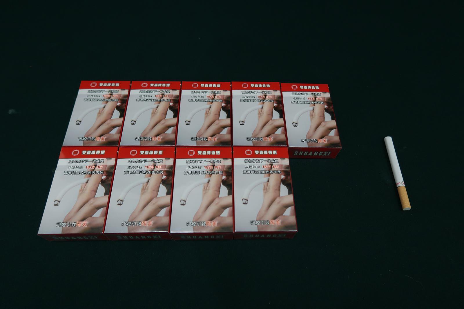 Two incoming passengers were sentenced to nine weeks' imprisonment and six weeks' imprisonment and fined $2,000 respectively by the Fanling Magistrates' Courts today (March 5) for possessing duty-not-paid cigarettes and failing to declare them to Customs officers, in contravention of the Dutiable Commodities Ordinance. Photo shows the duty-not-paid cigarettes seized from the personal baggage of a 63-year-old incoming male passenger.