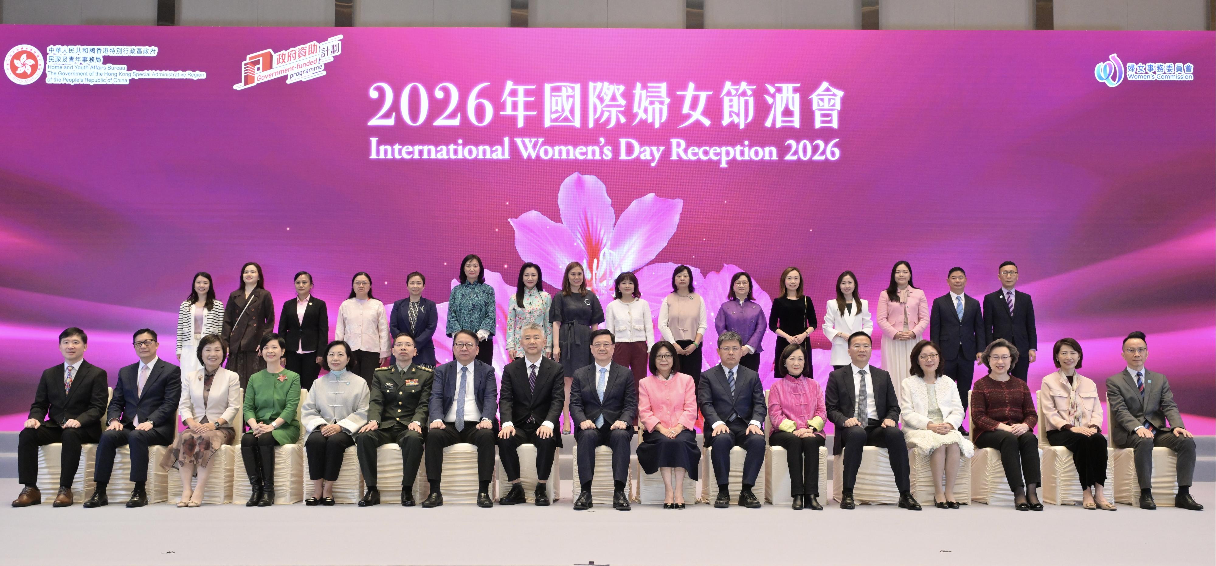 The Chief Executive, Mr John Lee, attended the International Women's Day Reception 2026 today (March 8). Photo shows (front row, from left) the Acting Secretary for Constitutional and Mainland Affairs, Mr Clement Woo; the Secretary for Security, Mr Tang Ping-keung; the Secretary for Education, Dr Choi Yuk-lin; the Secretary for Housing, Ms Winnie Ho; the Secretary for Home and Youth Affairs, Miss Alice Mak; Deputy Director of the Political Department of the Chinese People's Liberation Army Hong Kong Garrison Mr Li Shuangzhou; the Chief Secretary for Administration, Mr Chan Kwok-ki; Deputy Director of the Liaison Office of the Central People's Government in the Hong Kong Special Administrative Region (HKSAR) Mr Sun Shangwu; Mr Lee and his wife; Deputy Commissioner of the Office of the Commissioner of the Ministry of Foreign Affairs of the People's Republic of China in the HKSAR Mr Zhang Changwei; the Convenor of the Non-official Members of the Executive Council, Mrs Regina Ip; Deputy Director of the liaison office of the Office for Safeguarding National Security of the Central People's Government in the HKSAR Mr Xie Zhixiang; the Secretary for Development, Ms Bernadette Linn; the Secretary for the Civil Service, Mrs Ingrid Yeung; the Director of the Chief Executive's Office, Ms Carol Yip, and the Permanent Secretary for Home and Youth Affairs, Mr Patrick Li, at the reception.