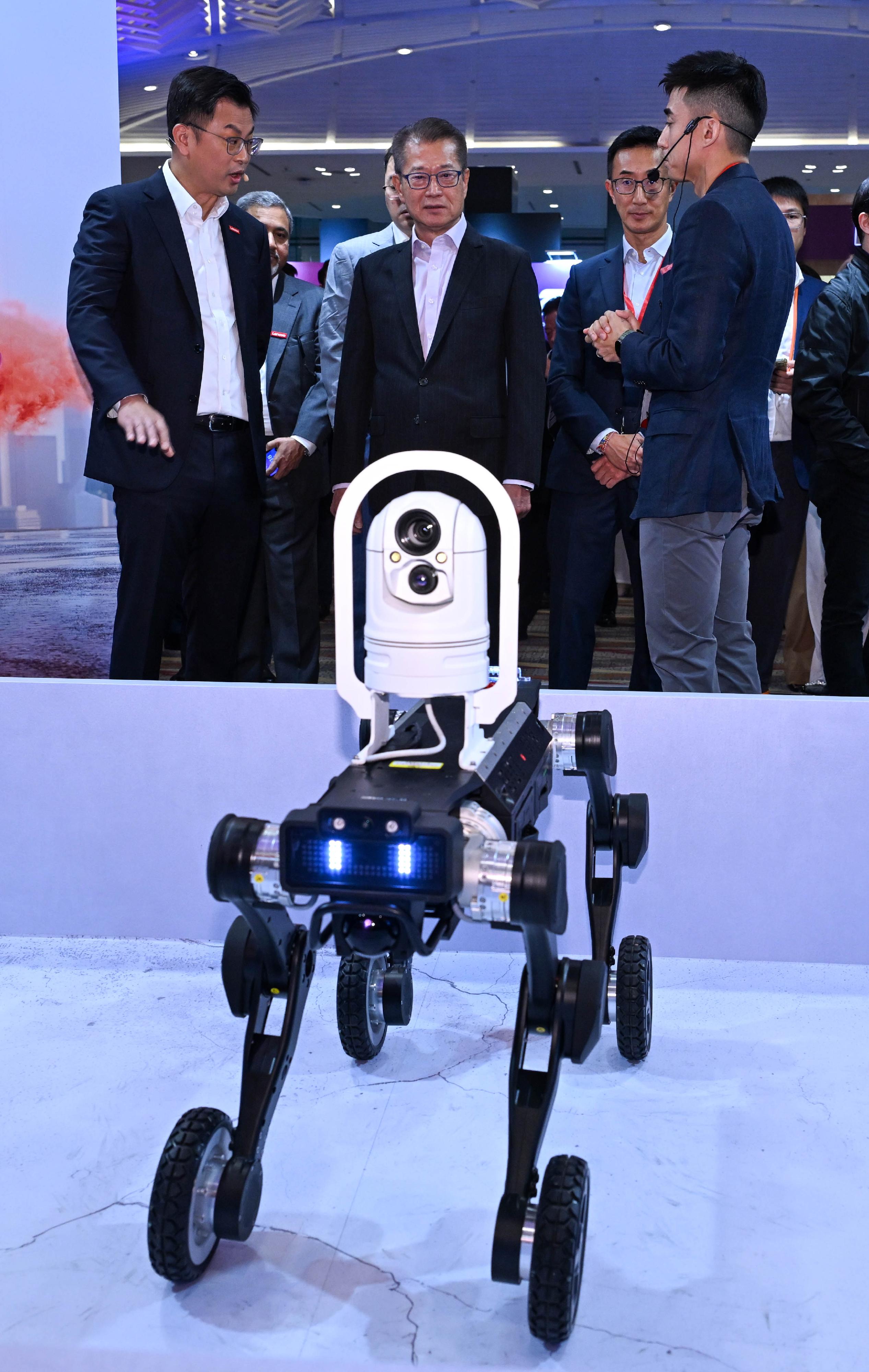 The Financial Secretary, Mr Paul Chan, attended the Lenovo Tech World '26 Hong Kong today (March 10). Photo shows Mr Chan (centre) touring an exhibition booth.