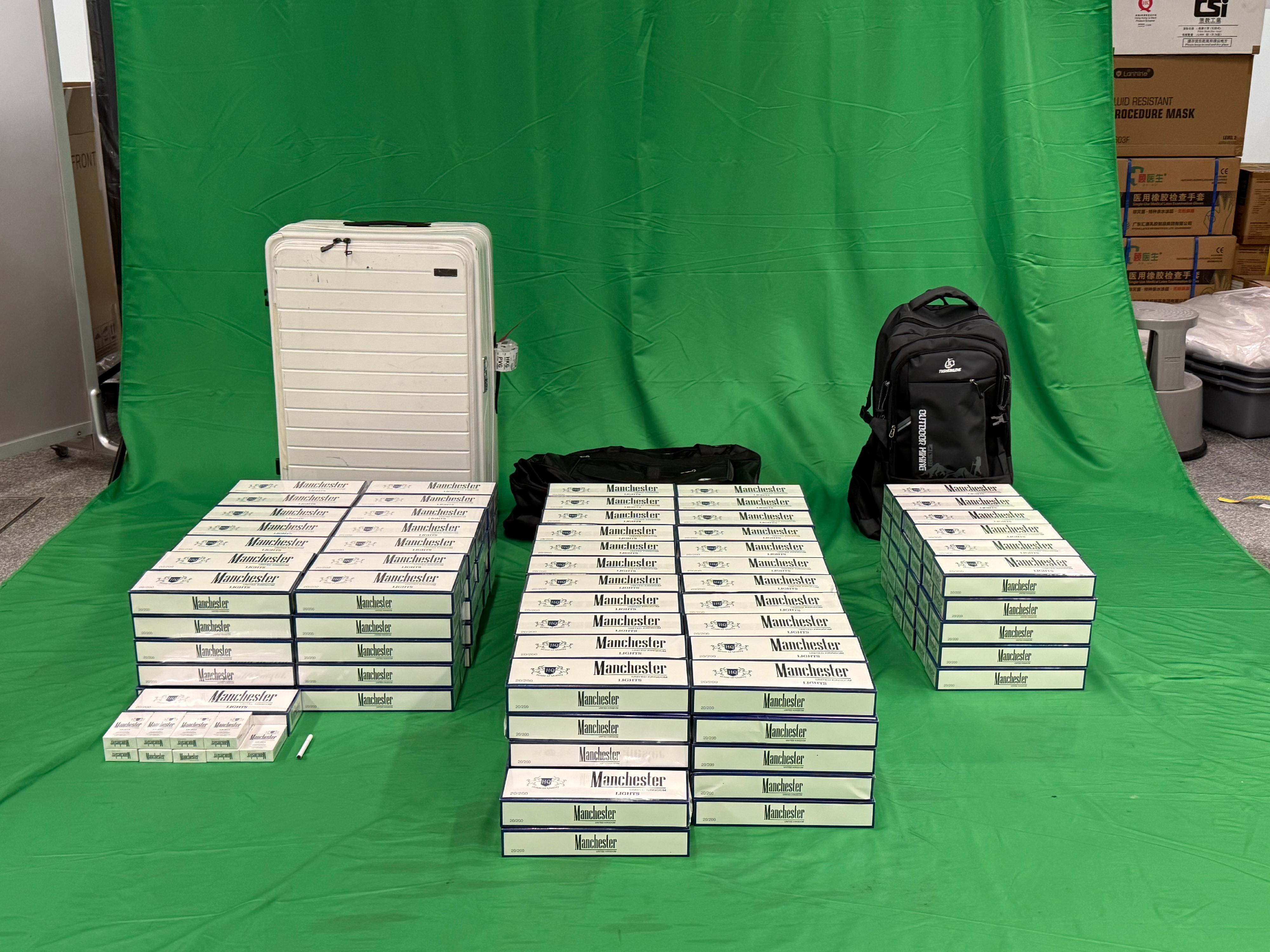 An incoming male passenger was sentenced to six months' imprisonment and fined $300 by the West Kowloon Magistrates' Courts today (March 10) for importing duty-not-paid cigarettes and failing to declare them to Customs Officers, in contravention of the Dutiable Commodities Ordinance. Photo shows the duty-not-paid cigarettes seized.

