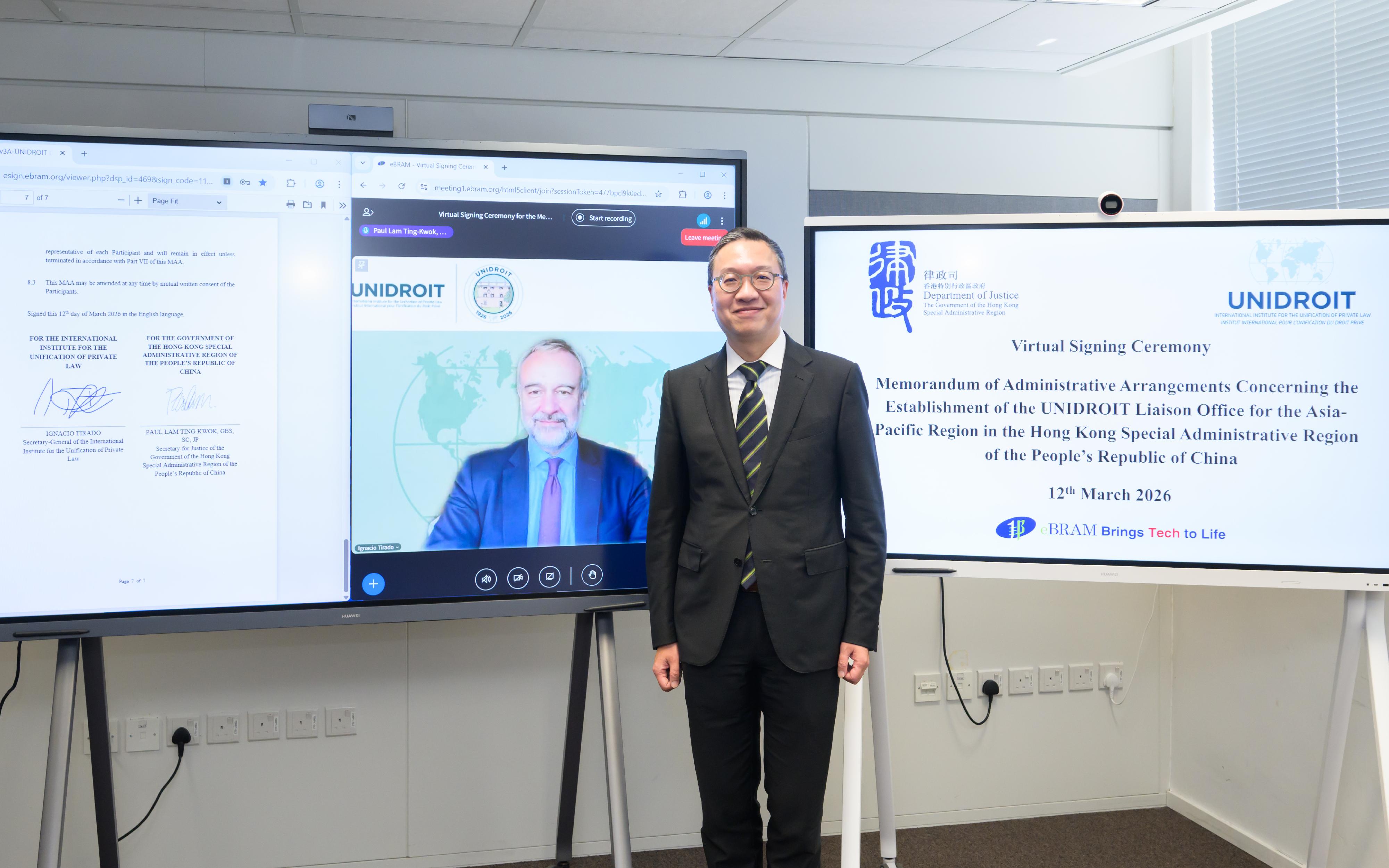 The Secretary for Justice, Mr Paul Lam, SC (right), and the Secretary-General of the International Institute for the Unification of Private Law (UNIDROIT), Professor Ignacio Tirado (left), signed a memorandum of administrative arrangements concerning the establishment of the UNIDROIT Liaison Office for the Asia-Pacific Region in the Hong Kong Special Administrative Region of the People's Republic of China, at a virtual signing ceremony today (March 12). 
