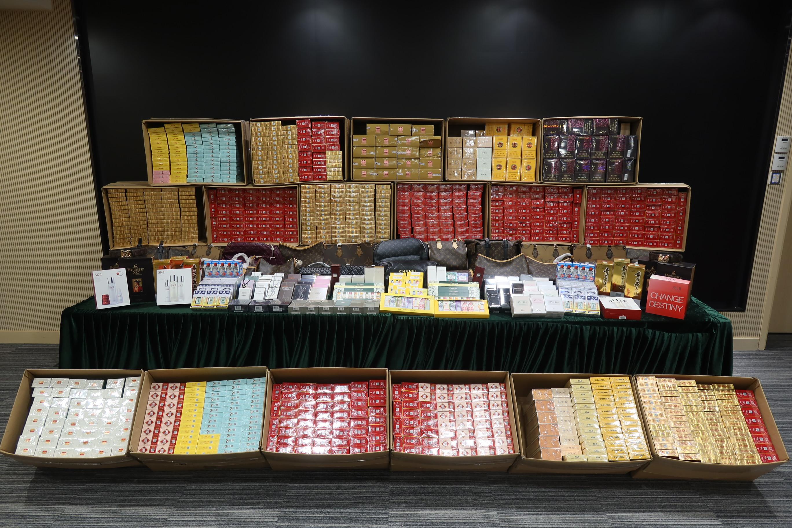 Hong Kong Customs mounted a special enforcement operation on Chung Ying Street, Sha Tau Kok, yesterday (March 11) to combat the sale of counterfeit goods. Photo shows some of the suspected counterfeit goods and suspected illicit cigarettes seized.