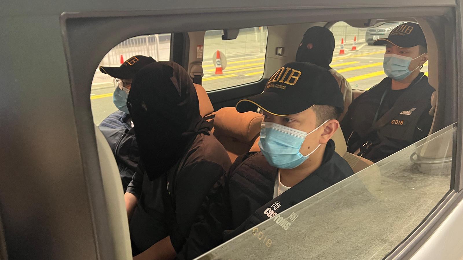 Hong Kong Customs detected a drug trafficking case involving two incoming air passengers at Hong Kong International Airport yesterday (March 14) and seized about 8 kilograms of suspected cannabis buds with an estimated market value of about $1.7 million. Photo shows the two arrested persons involved in the case.