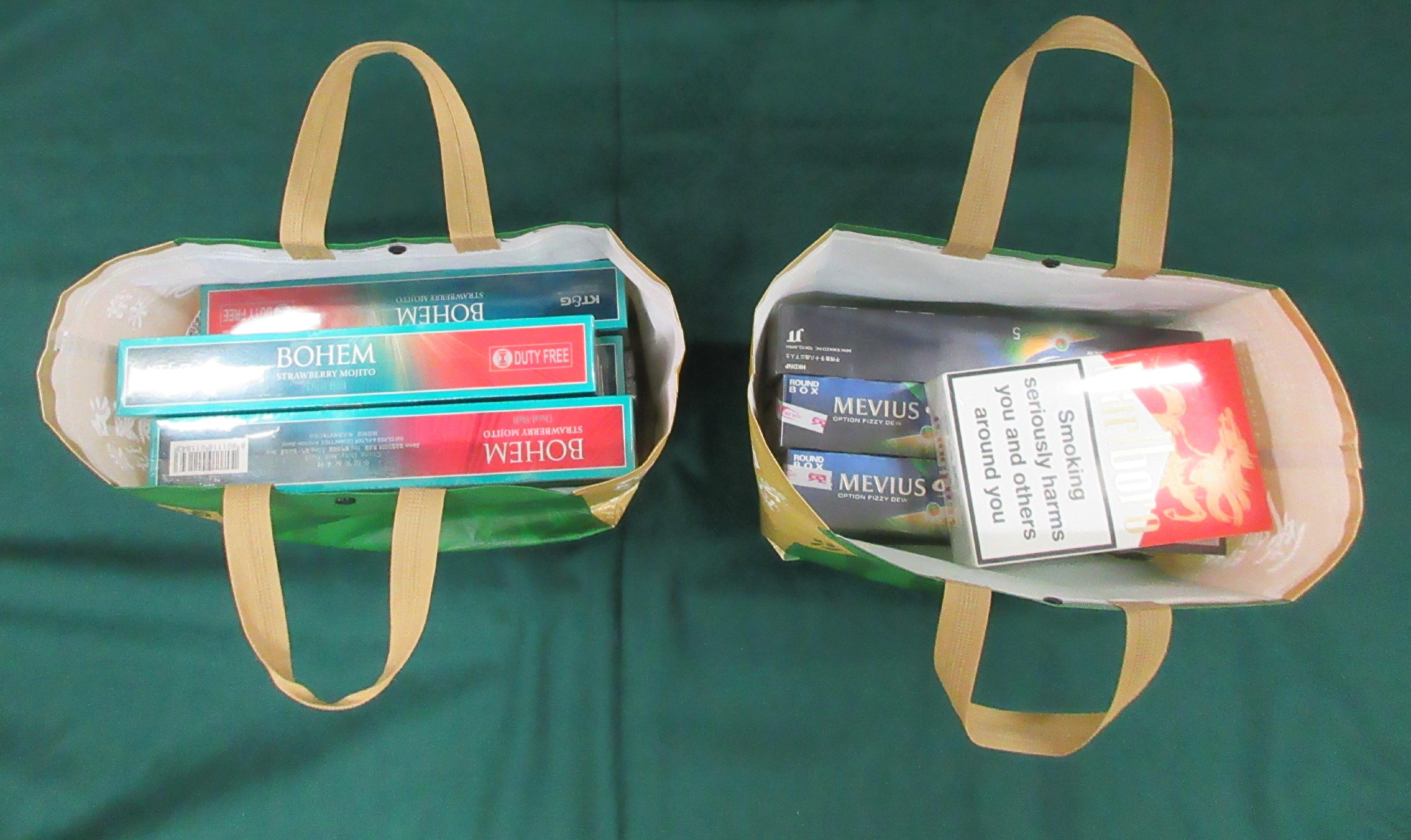 An incoming male passenger was sentenced to six weeks and 20 days' imprisonment and fined $4,000 by the Fanling Magistrates' Courts today (March 17) for possessing duty-not-paid cigarettes and failing to declare them to Customs officers, in contravention of the Dutiable Commodities Ordinance. Photo shows the duty-not-paid cigarettes contained in recycled bags.
