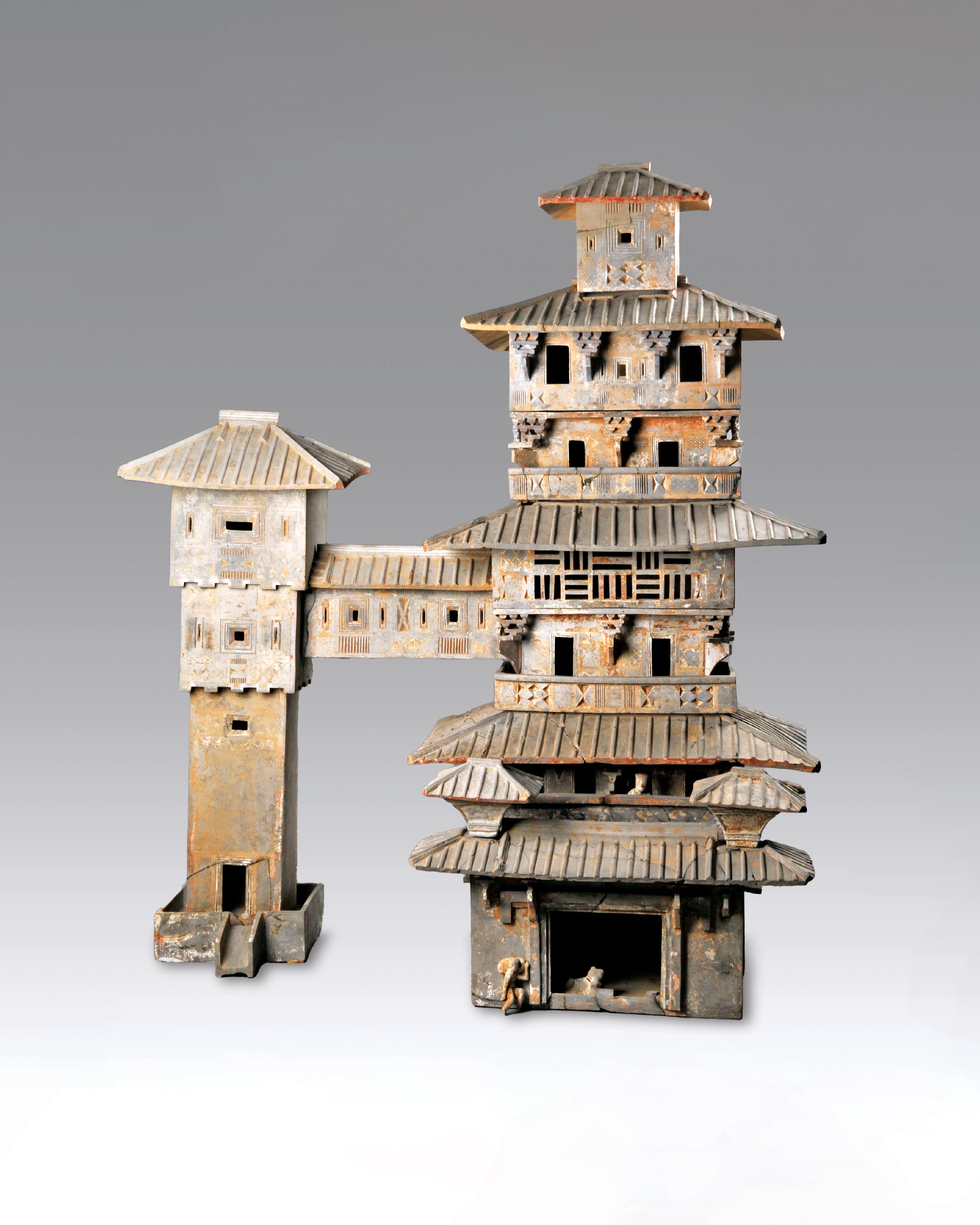 The opening ceremony of the exhibition titled &ldquo;The Majestic Han: A Golden Age of Vigour and Cultural Integration&rdquo; was held today (March 19) at the Hong Kong Heritage Discovery Centre. Photo shows a seven‑storey painted pottery granary house with linked pavilion. 