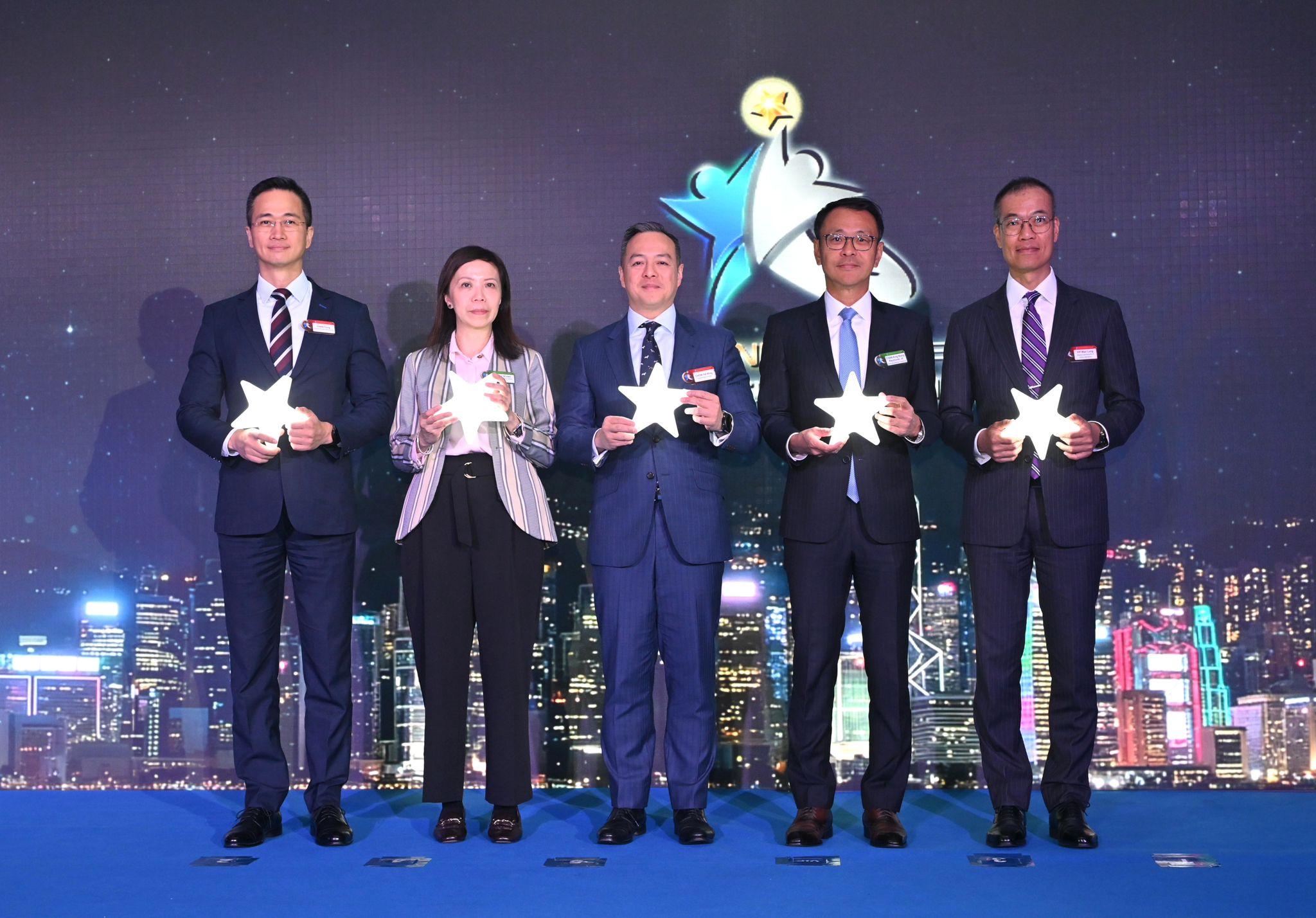 The Police held the 2026 Bank Staff Recognition Ceremony today (March 20). Photo shows the Commissioner of Police, Mr Chow Yat-ming (center), the Deputy Commissioner of Police (Operations), Mr Yip Wan-lung (first right), the Director of Crime and Security, Mr Chan Tung (first left), the Executive Director (Enforcement and AML) of the Hong Kong Monetary Authority, Mr Raymond Chan (second right); and the representative of the HKAB, Ms Grace Yeung (second left) officiating the ceremony.