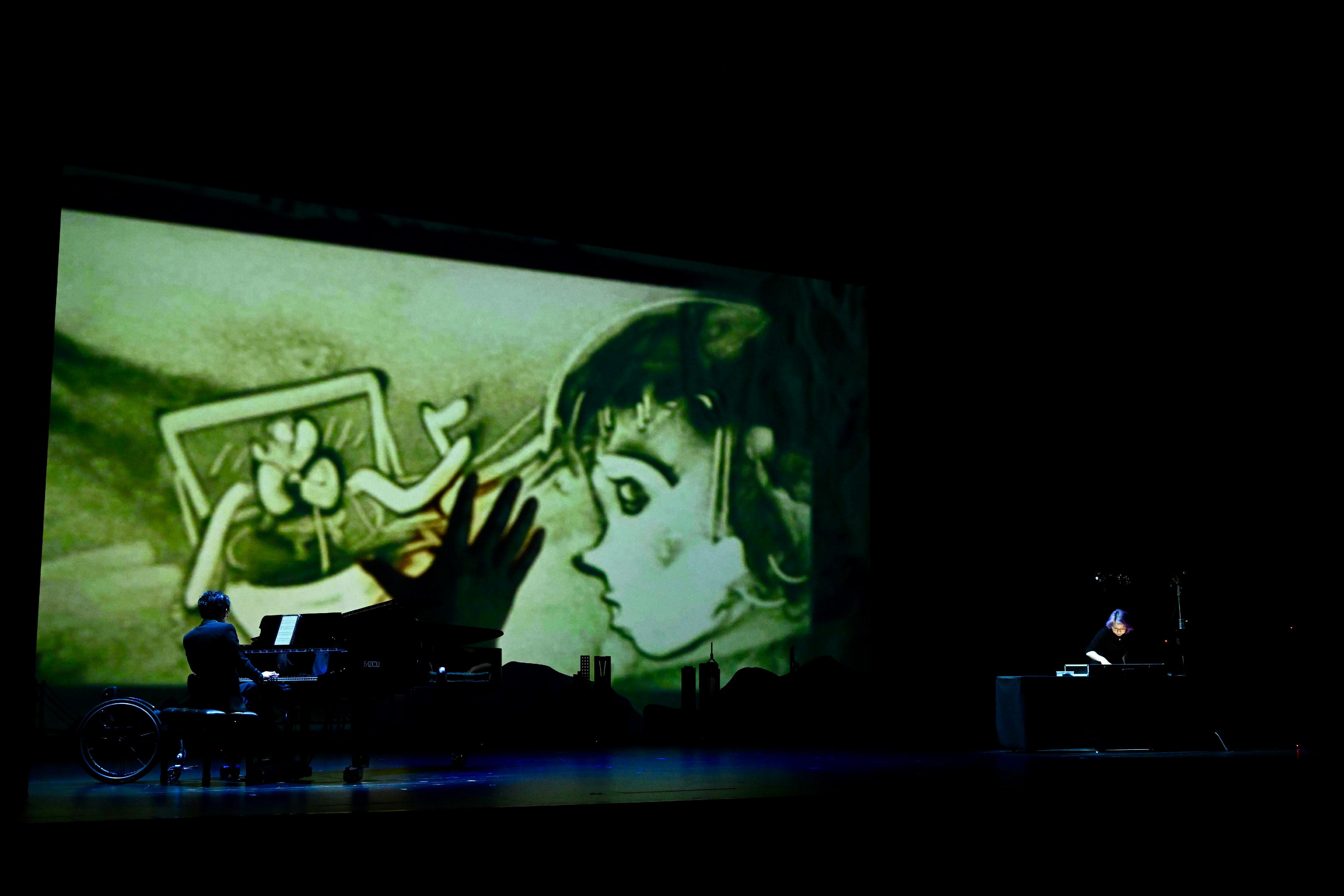 The Secretary for Labour and Welfare, Mr Chris Sun, officiated at the opening ceremony of the Diversity and Inclusion Arts Festival 2026 today (March 20). Photo shows two artists with disabilities  giving a multimedia performance using sand art and a piano.