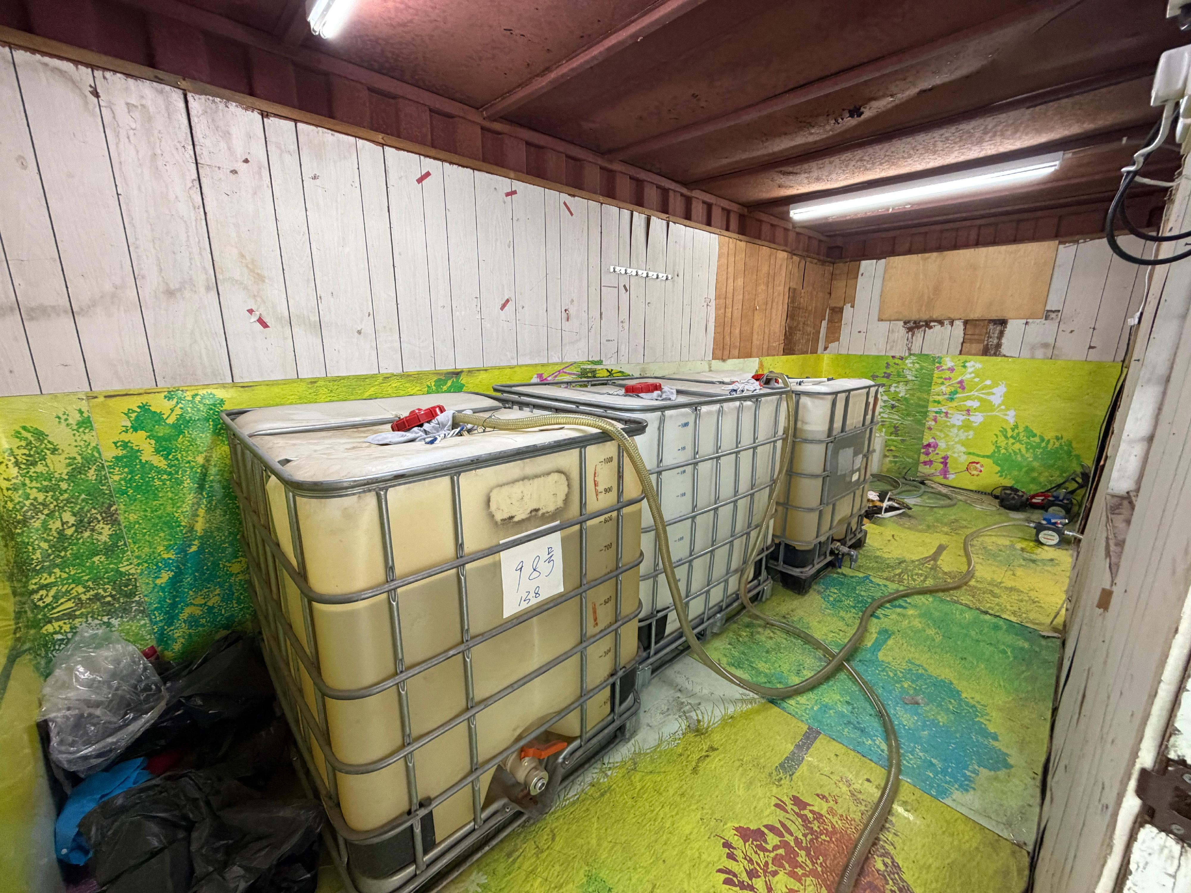 Hong Kong Customs, the Fire Services Department and the Hong Kong Police Force mounted an anti-illicit fuel joint operation yesterday (March 19). Photo shows the motor spirit containers seized in an illicit fuel storage site shut down in Sheung Shui.
