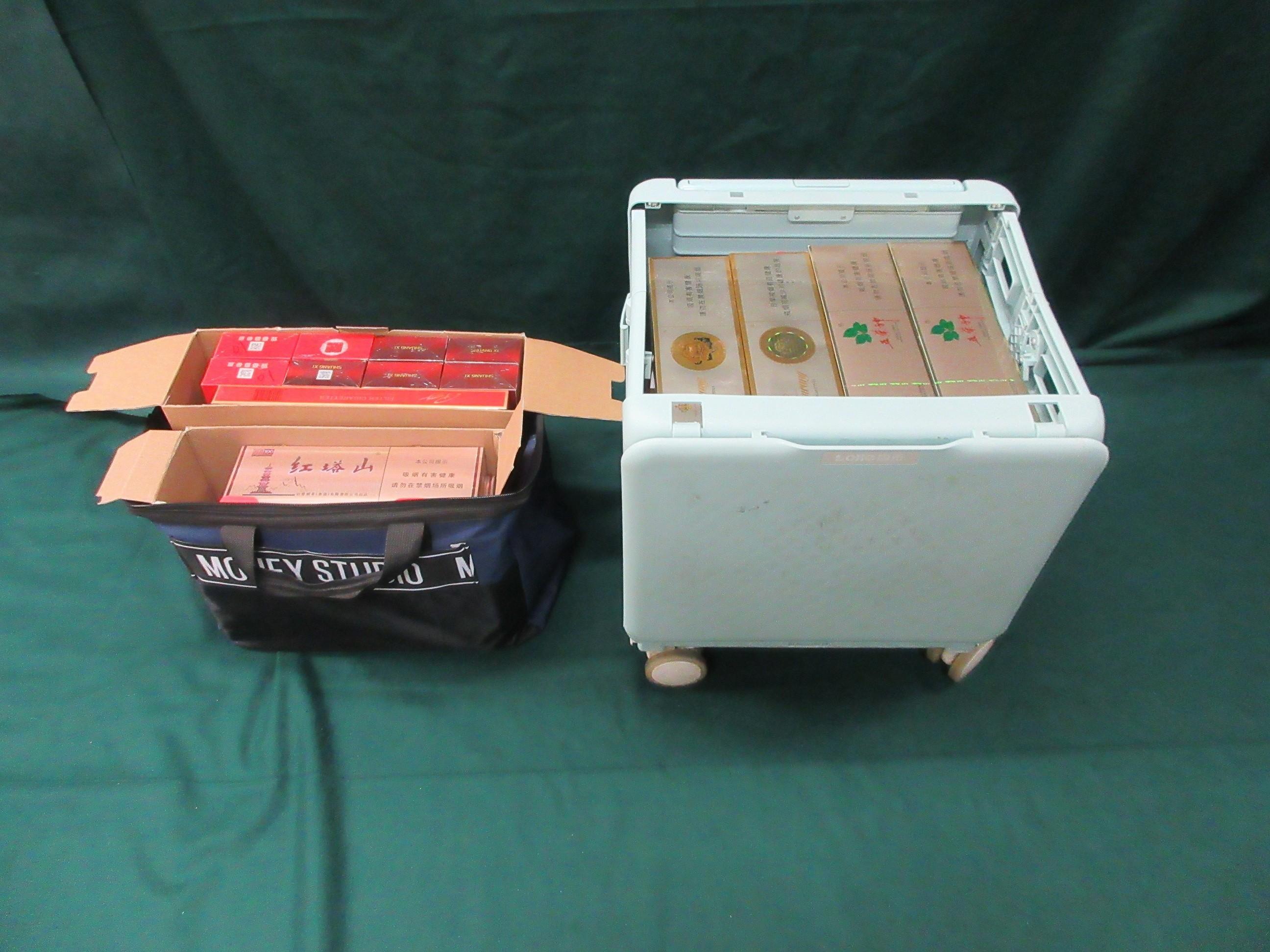 An incoming male passenger was sentenced to three months' imprisonment and fined $1,000 by the Fanling Magistrates' Courts today (March 20) for possessing duty-not-paid cigarettes and failing to declare them to Customs officers, in contravention of the Dutiable Commodities Ordinance. Photo shows the duty-not-paid cigarettes contained in a carrier bag and a trolley.