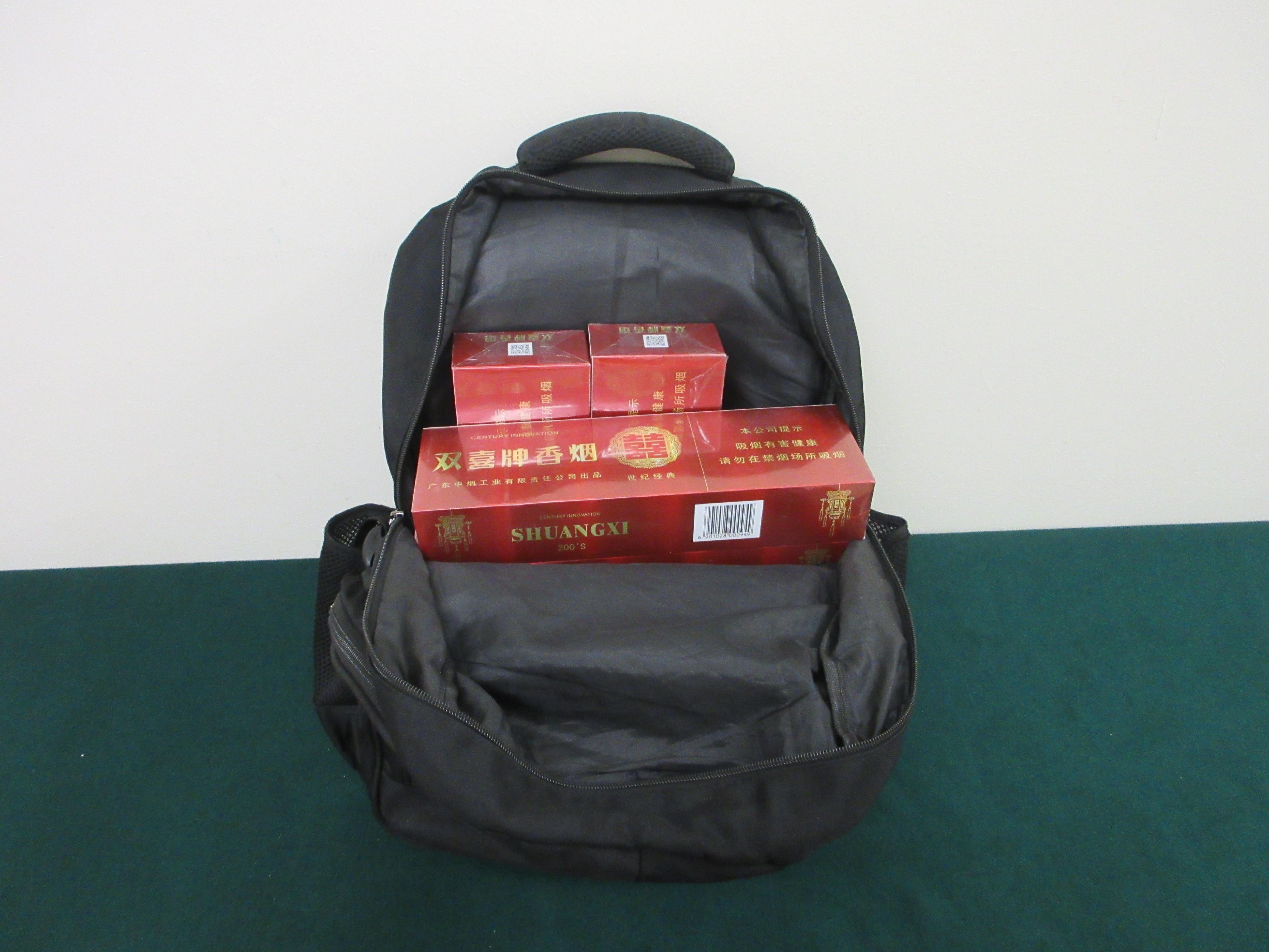 ​Three incoming passengers were sentenced by the courts today (March 23) to 12 weeks' imprisonment and fined $1,800; two months' imprisonment and fined $1,500; and six months' imprisonment and fined $1,000 respectively for possessing duty-not-paid cigarettes and failing to declare them to Customs officers, in contravention of the Dutiable Commodities Ordinance. Photo shows duty-not-paid cigarettes seized from the personal baggage of a 75-year-old incoming male passenger.