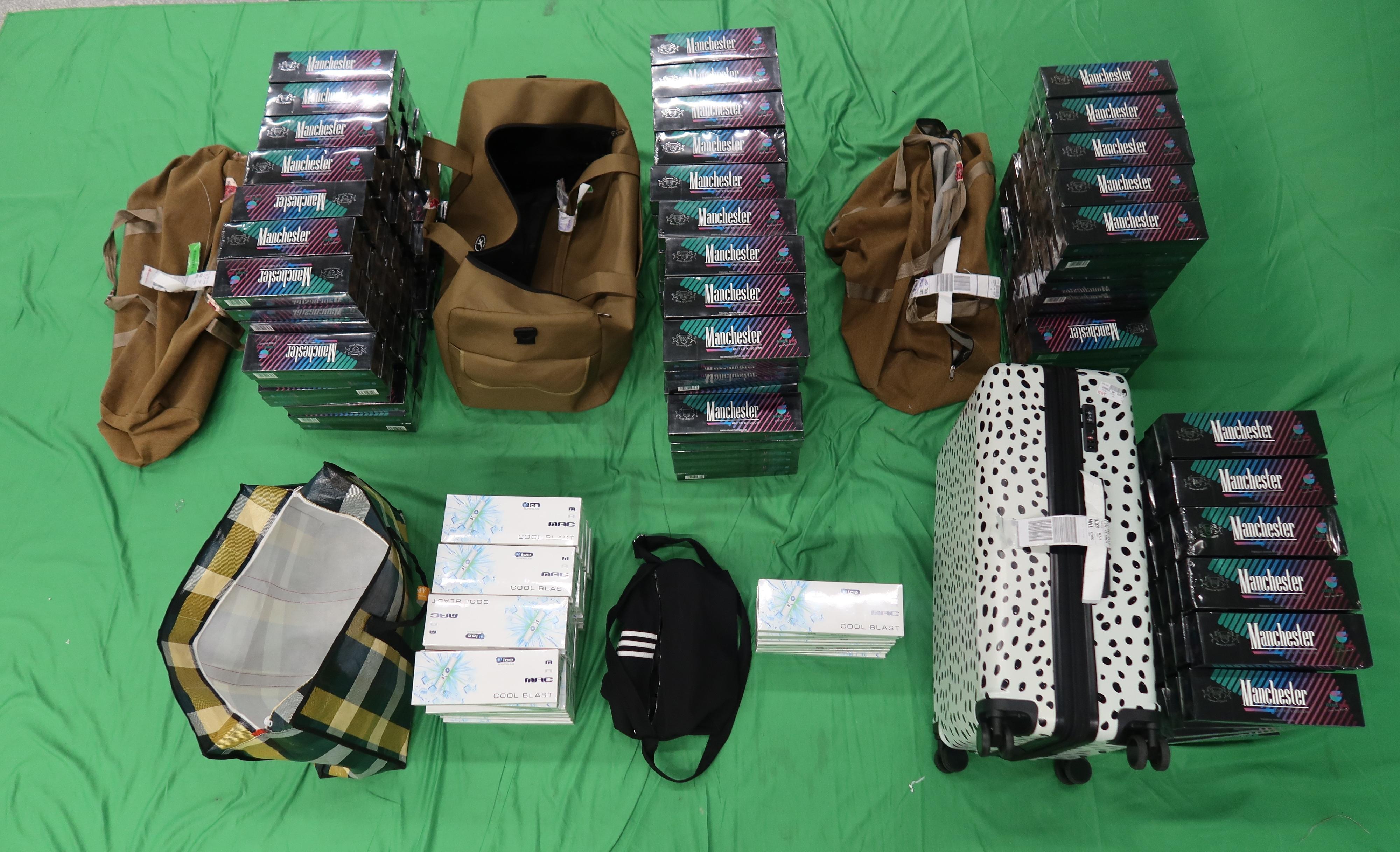 ​Three incoming passengers were sentenced by the courts today (March 23) to 12 weeks' imprisonment and fined $1,800; two months' imprisonment and fined $1,500; and six months' imprisonment and fined $1,000 respectively for possessing duty-not-paid cigarettes and failing to declare them to Customs officers, in contravention of the Dutiable Commodities Ordinance. Photo shows duty-not-paid cigarettes seized from the personal baggage of a 43-year-old incoming male passenger.
