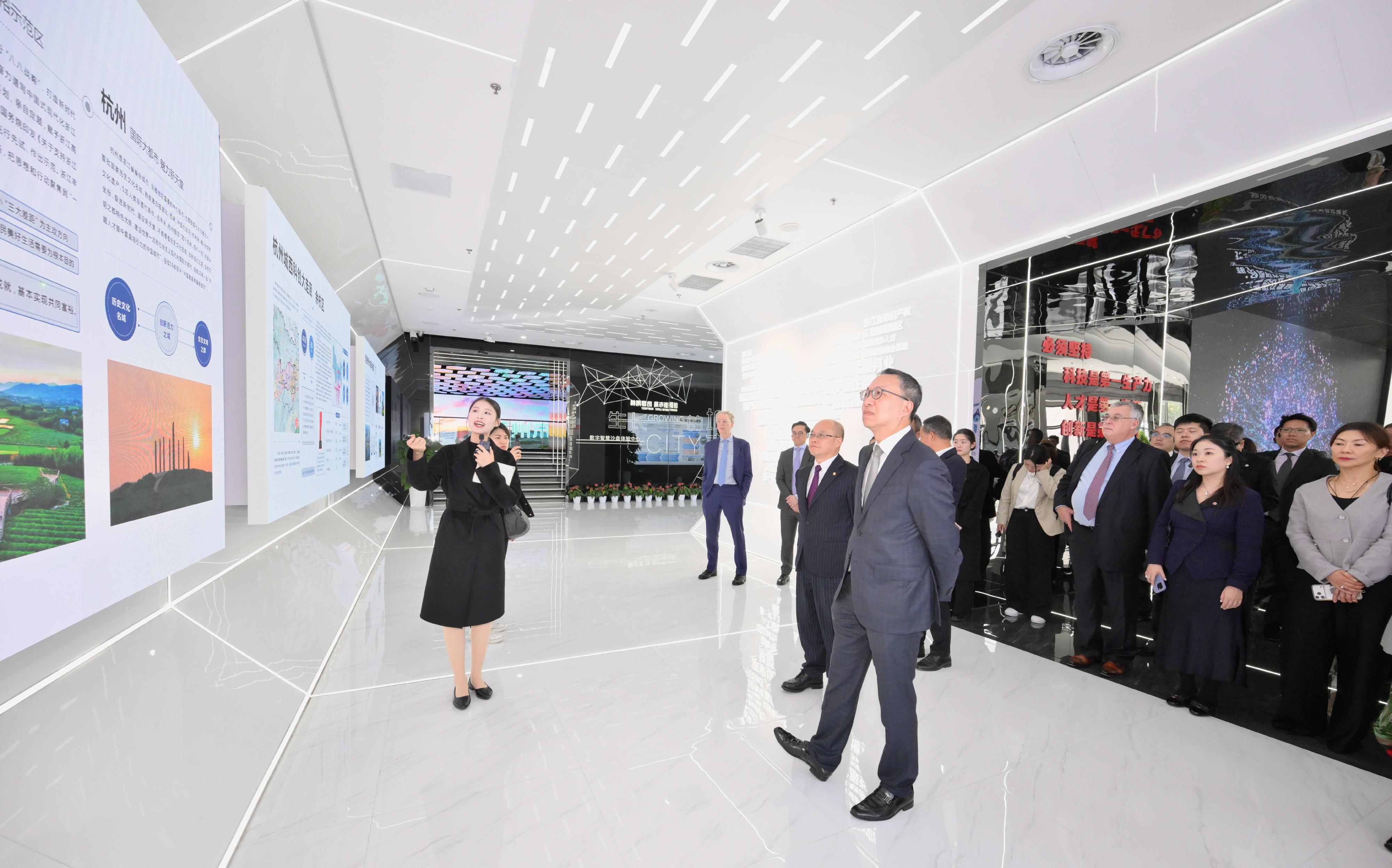 The Secretary for Justice, Mr Paul Lam, SC (front, right), together with his delegation, visited the Hangzhou Future Sci-Tech City Urban Exhibition Center today (March 25) to gain insights into Hangzhou's advancements in areas including smart city development and AI.