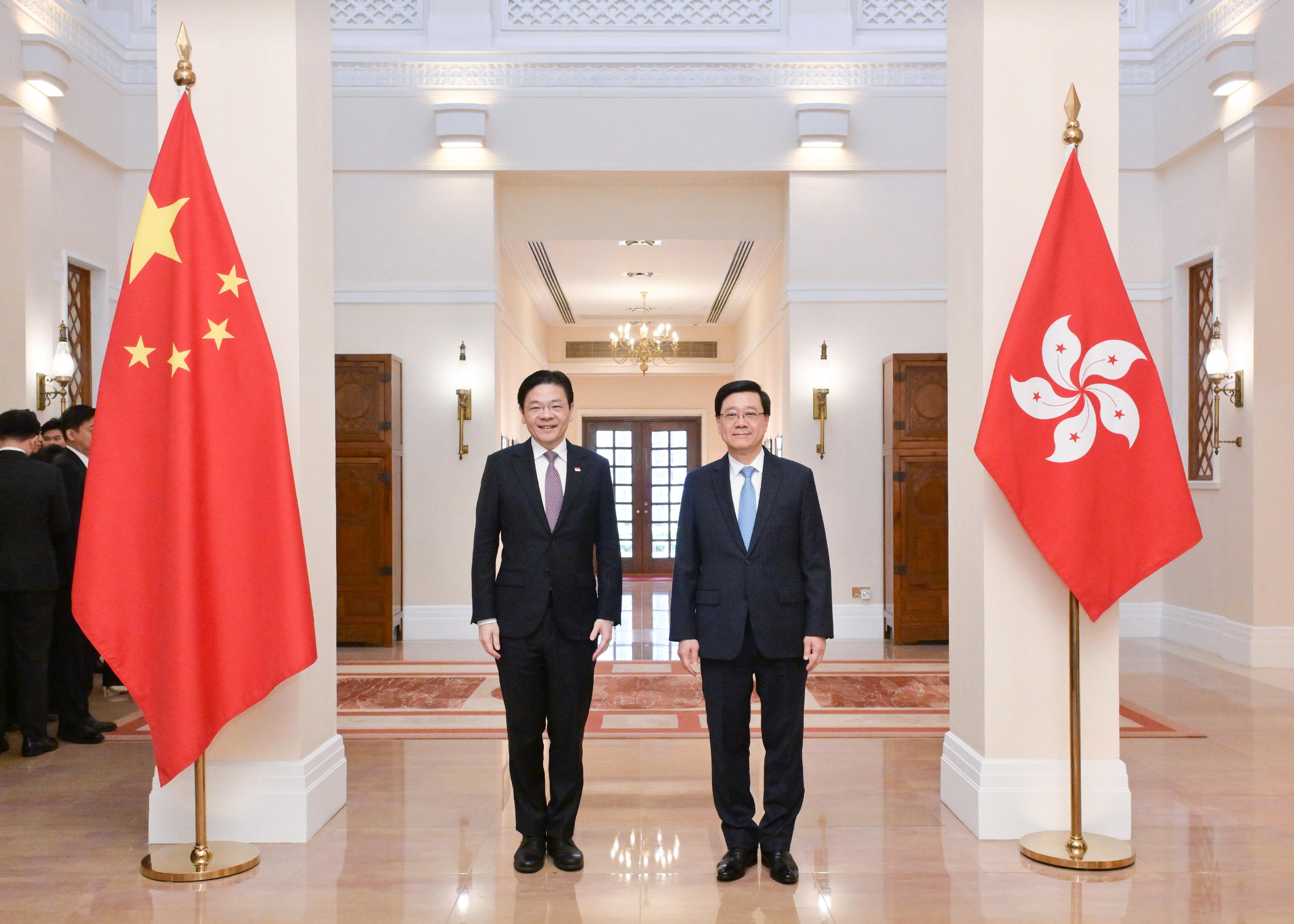 The Chief Executive, Mr John Lee (right), meets with the visiting Prime Minister and Minister for Finance of Singapore, Mr Lawrence Wong (left), at Government House today (March 27).