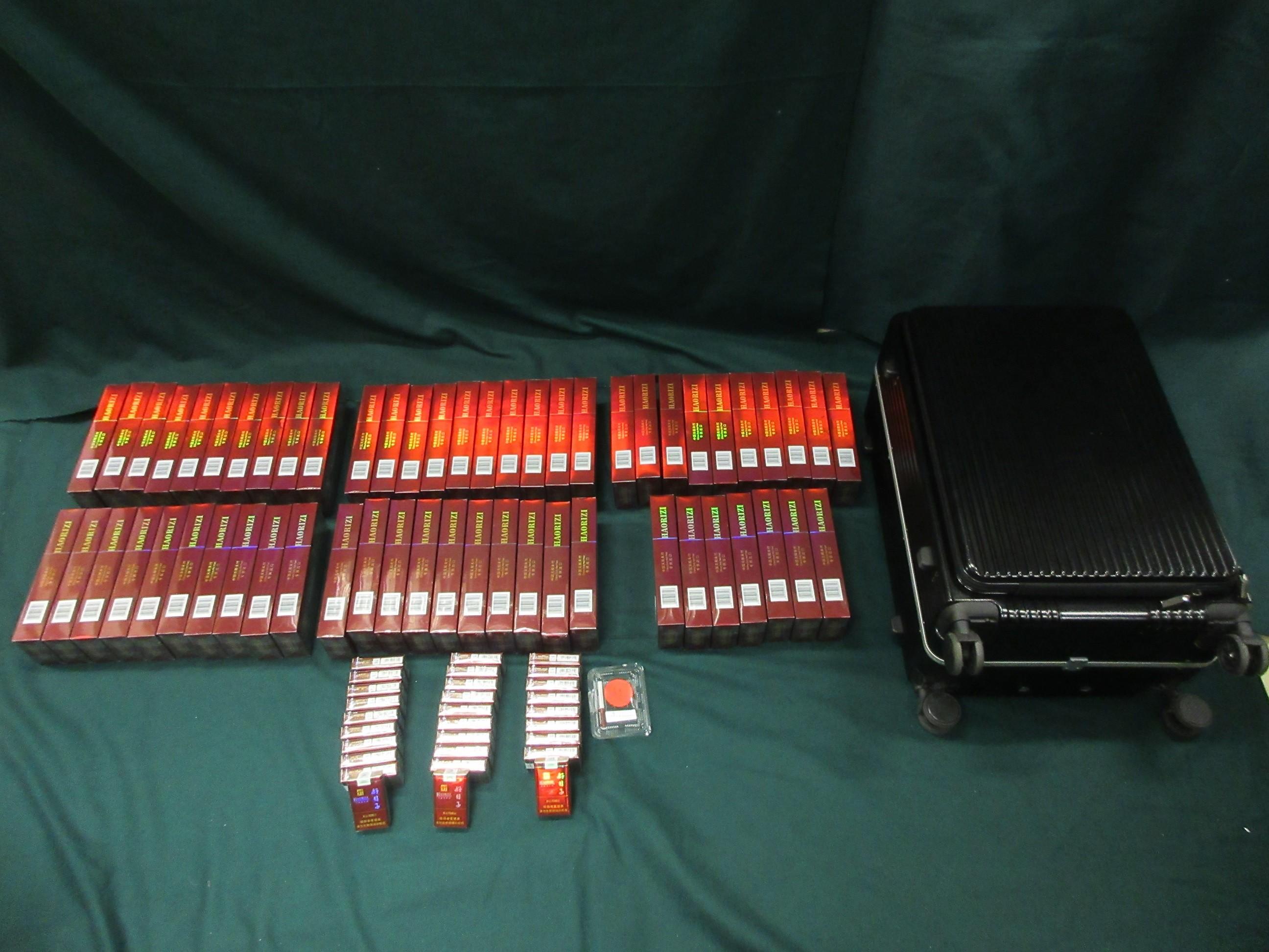 Four incoming passengers were sentenced to three months' imprisonment and a fine of $4,000, two months' imprisonment with a fine of $2,000 and two months&rsquo; imprisonment with a fine of $5,000 respectively by the Fanling Magistrates' Courts today (March 30) for possessing or importing duty-not-paid cigarettes and failing to declare them to Customs officers, in contravention of Dutiable Commodities Ordinance. Photo shows the duty-not-paid cigarettes seized from the personal baggage of a 37-year-old incoming female passenger.