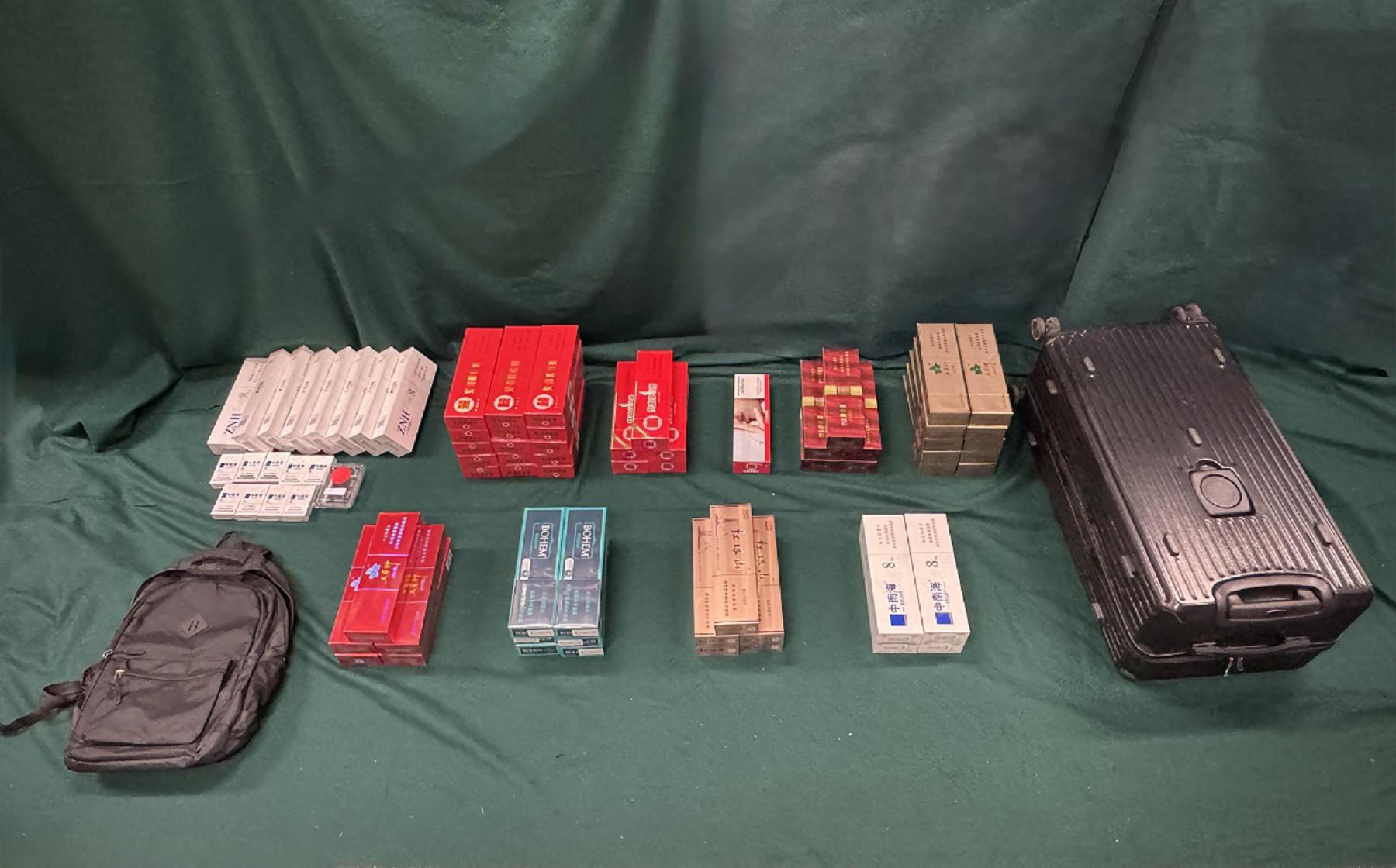Four incoming passengers were sentenced to three months' imprisonment and a fine of $4,000, two months' imprisonment with a fine of $2,000 and two months&rsquo; imprisonment with a fine of $5,000 respectively by the Fanling Magistrates' Courts today (March 30) for possessing or importing duty-not-paid cigarettes and failing to declare them to Customs officers, in contravention of Dutiable Commodities Ordinance. Photo shows the duty-not-paid cigarettes seized from the personal baggage of a 27-year-old incoming male passenger.